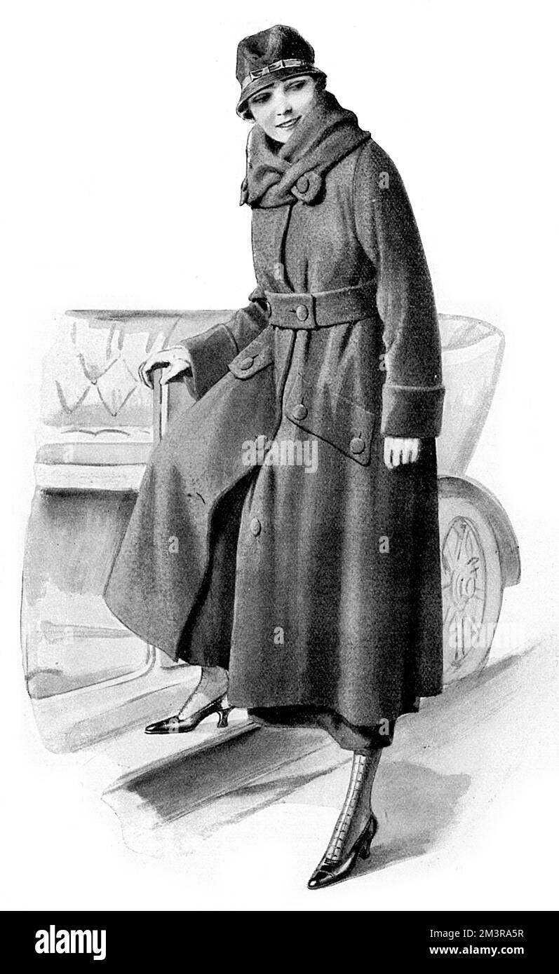 he needs of the enthusiastic female motorist well catered for by this Romeotor coat carried out in Scotch fleece, cut comfortably full with a modish wrap collar which could be arranged as a cape if desired.  Available for 9 guineas from Samuel Brothers.  The accompanying motor hat is one guinea; the little brim successfully protects the eyes and the brown leather band and bow give a neat finish.       Date: 1919 Stock Photo