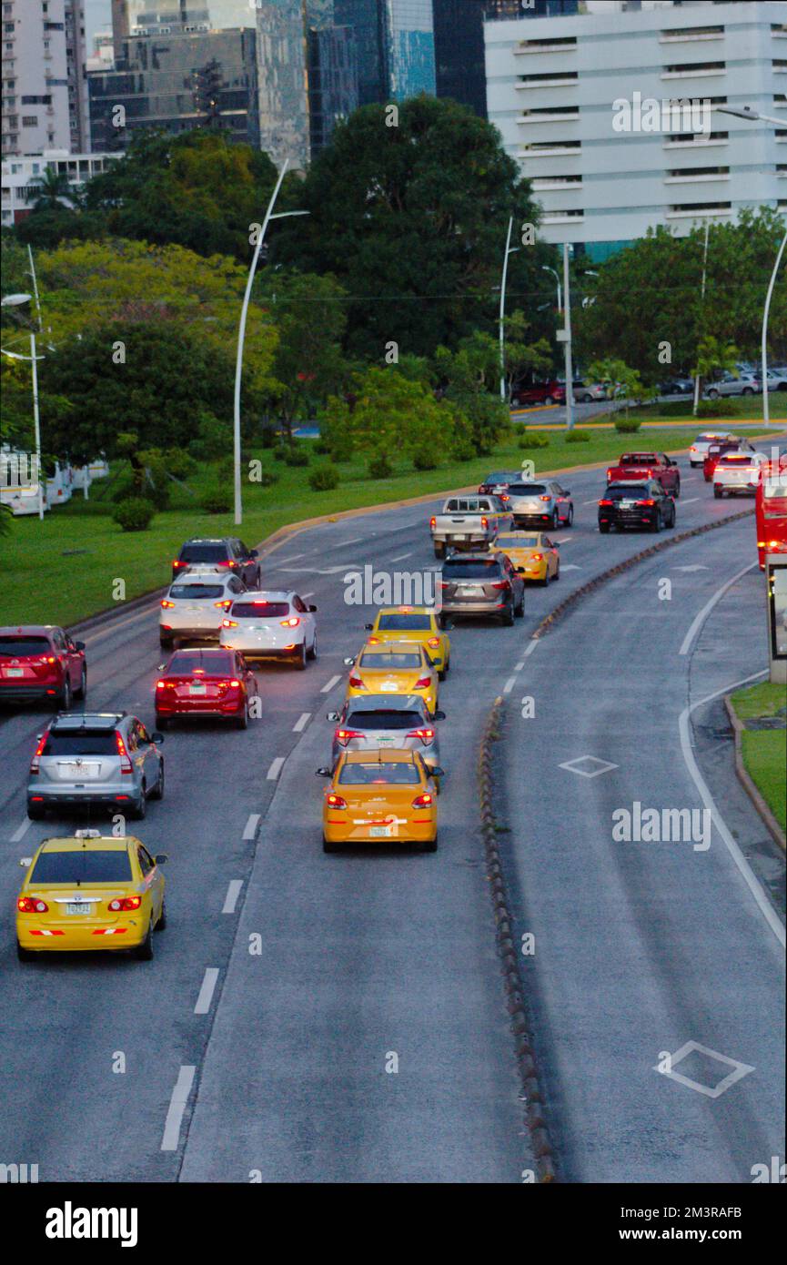 avenue with various types of cars of different colors Stock Photo