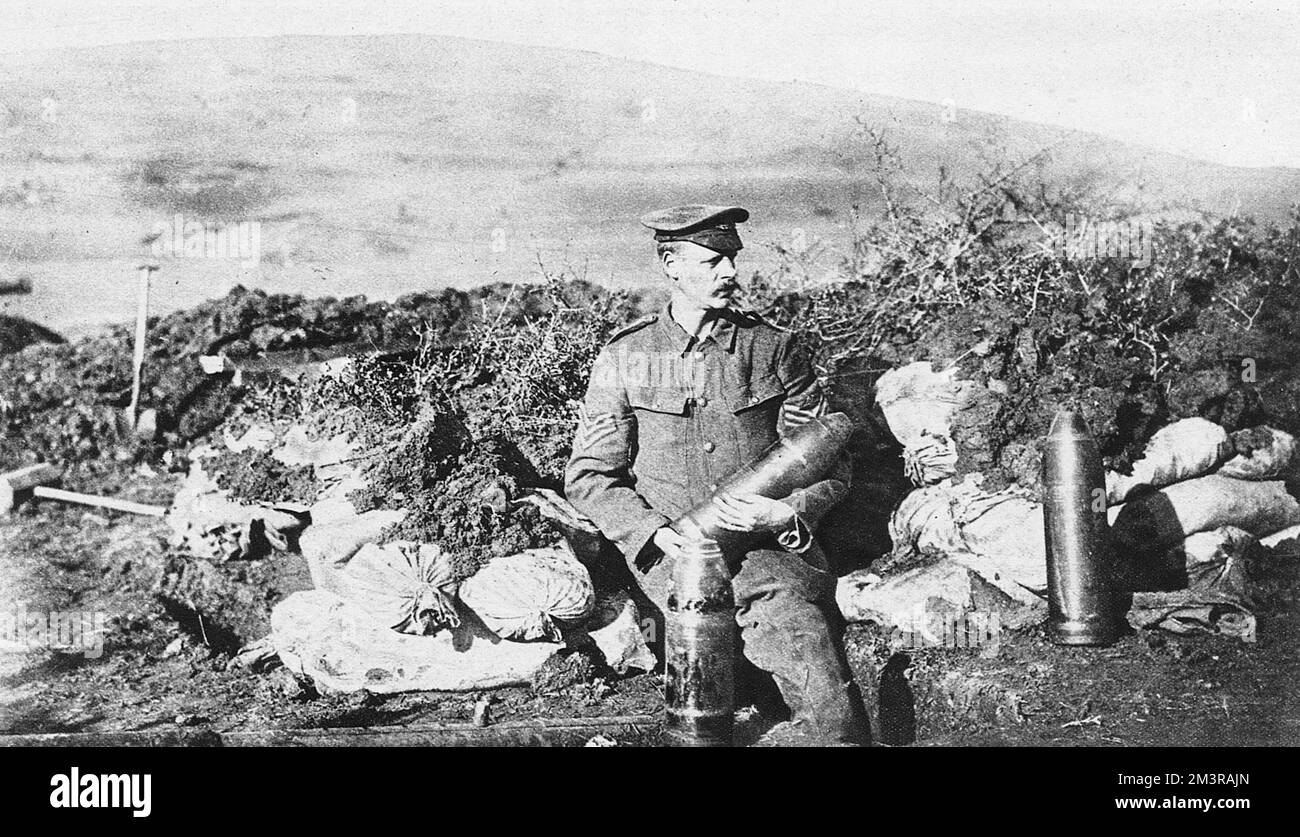 A British soldier near an underground bombproof magazine designed as a
