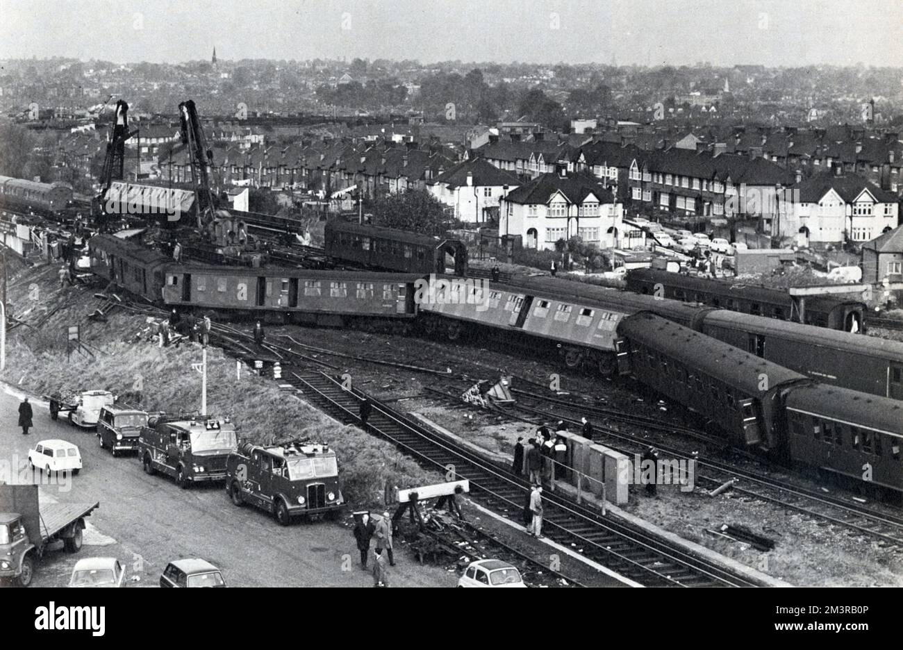 Photograph showing the derailed Hastings-London express train near Hither Green, after the accident which took place on November 5th. Ten of the twelve coaches were derailed, and 53 people were killed and 139 injured.     Date: 1967 Stock Photo