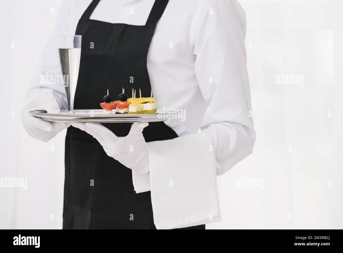 Servant uniform holding tray. Resolution and high quality beautiful photo Stock Photo