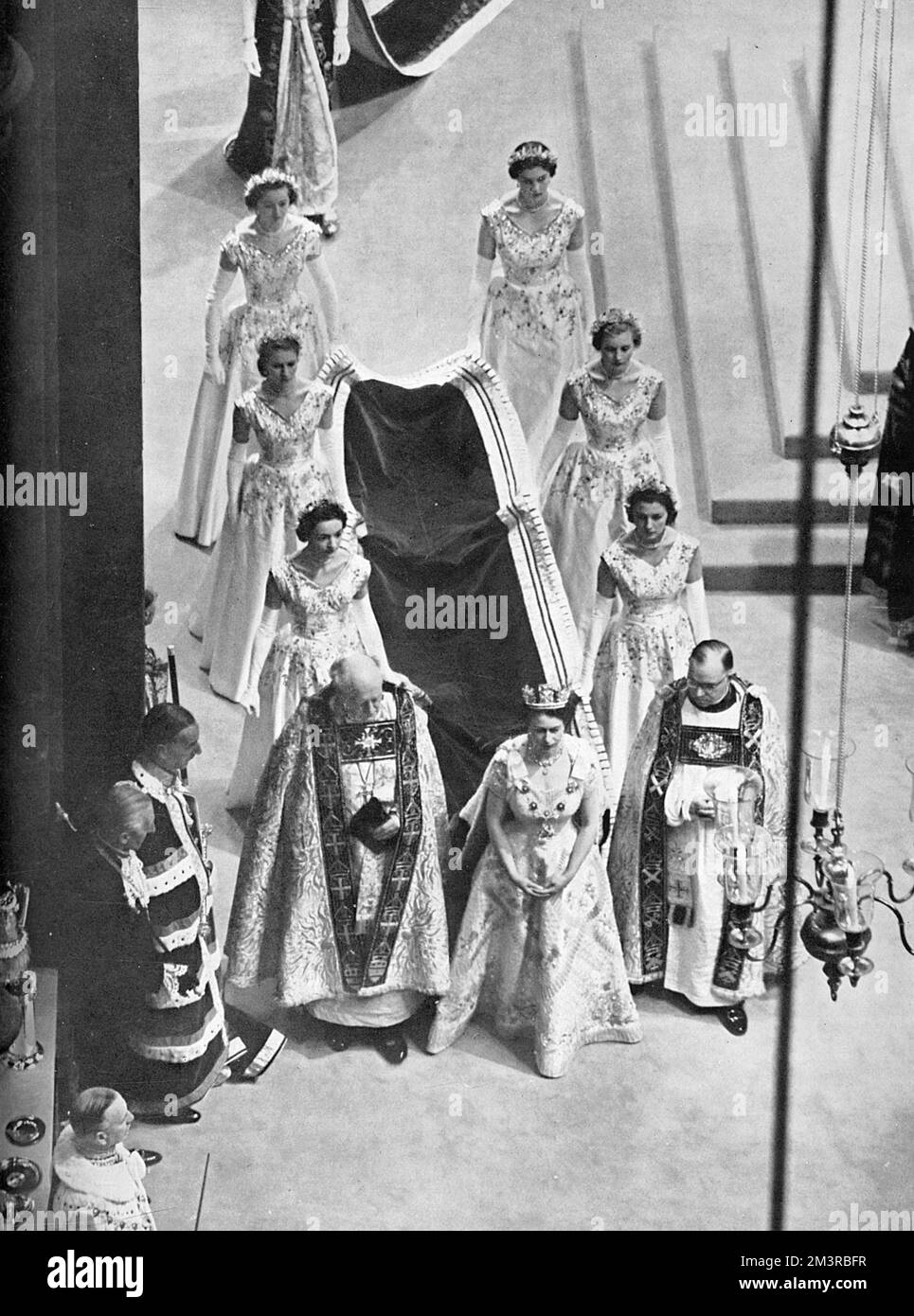 View of the State Procession down the Nave led by H. M. The Queen, flanked by her Maids of Honour after the Coronation ceremony in Westminster Abbey on June 2nd 1953.     Date: 1953 Stock Photo