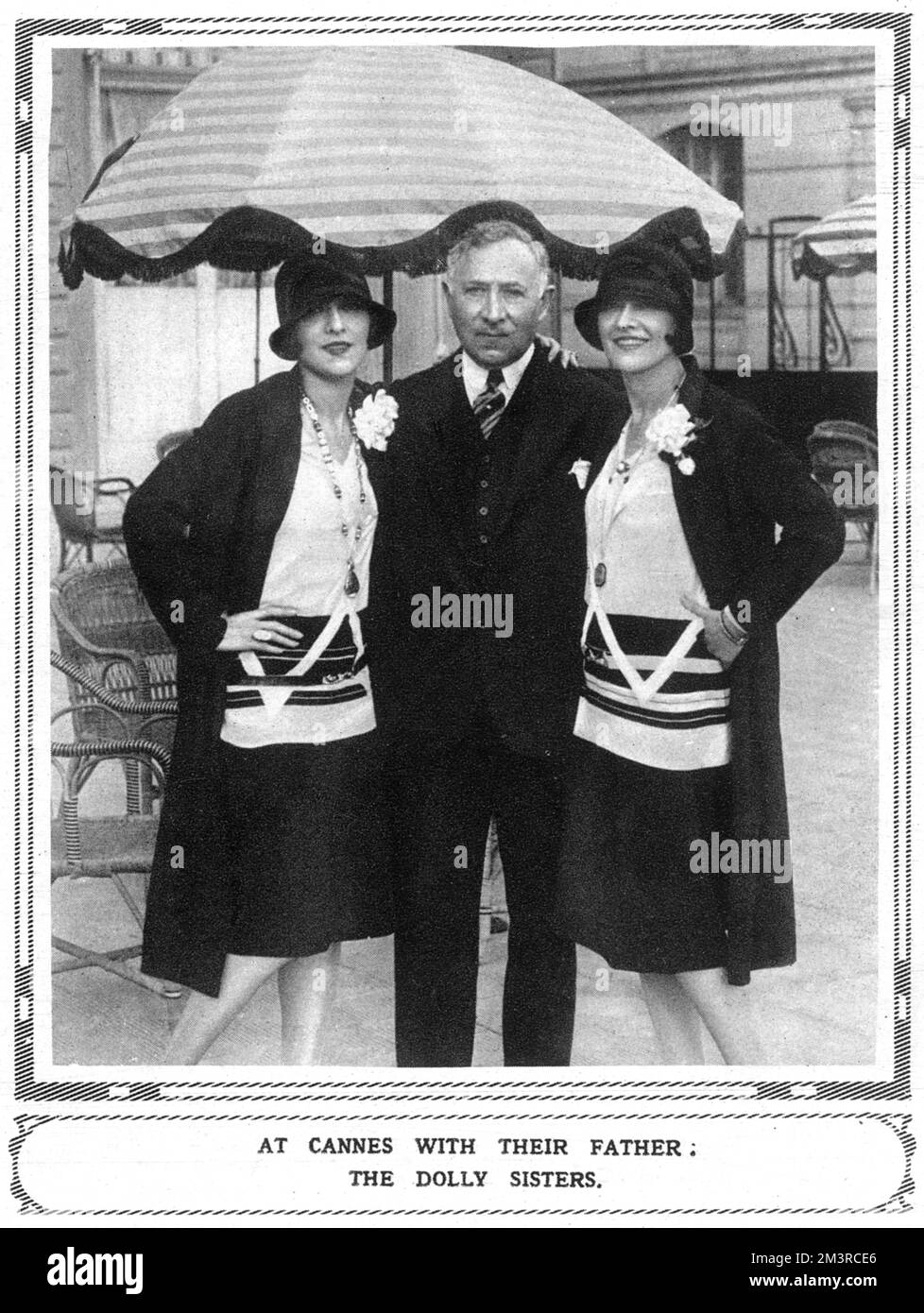 The famous cabaret stars, the Dolly Sisters (Jennie and Rosie) pictured with their father at Cannes on the French Riviera in 1928.  1928 Stock Photo