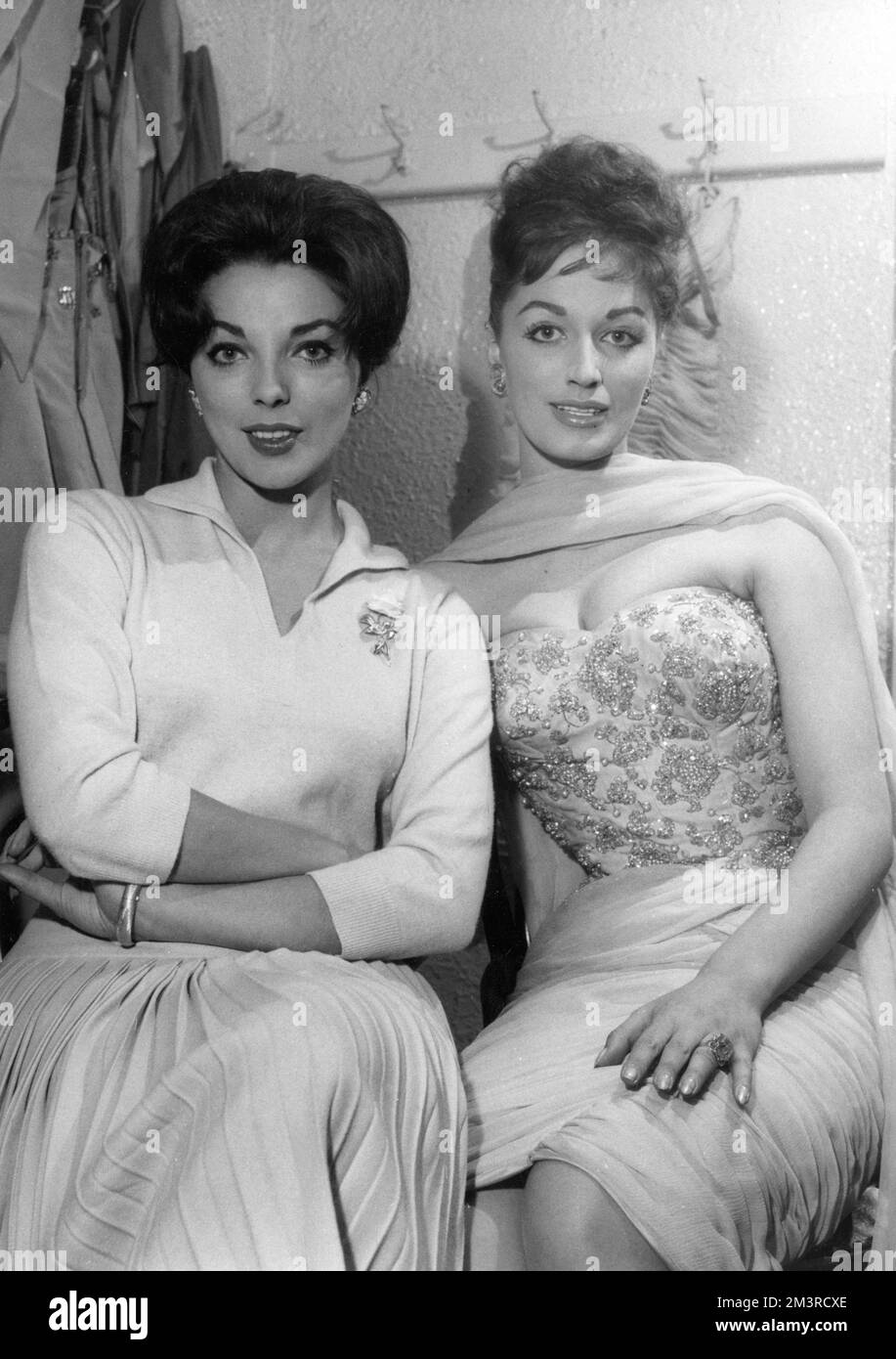 Joan Collins, actress (born 1933), together with her sister Jackie Collins, novelist (1937-2015), c.1955     Date: 1950s Stock Photo