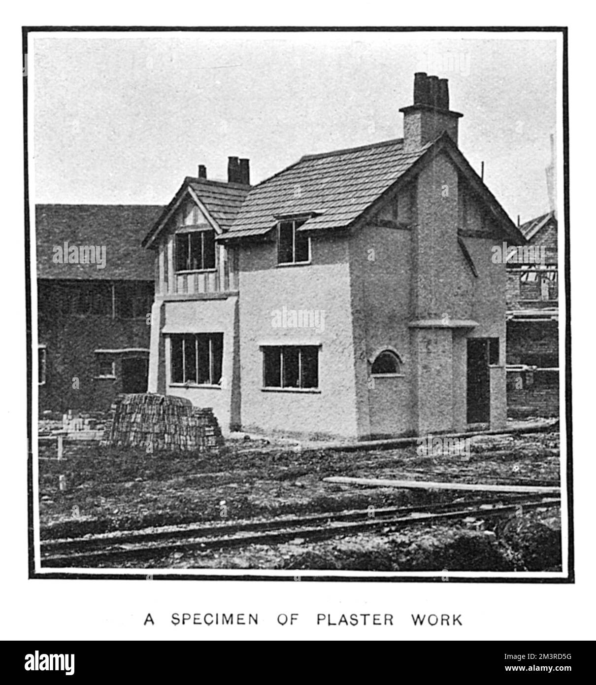 One of the cottages on show at the Cheap Cottages exhibition at Letchworth Garden City and Hitchin, descibed as a specimen of plaster work.      Date: 1905 Stock Photo