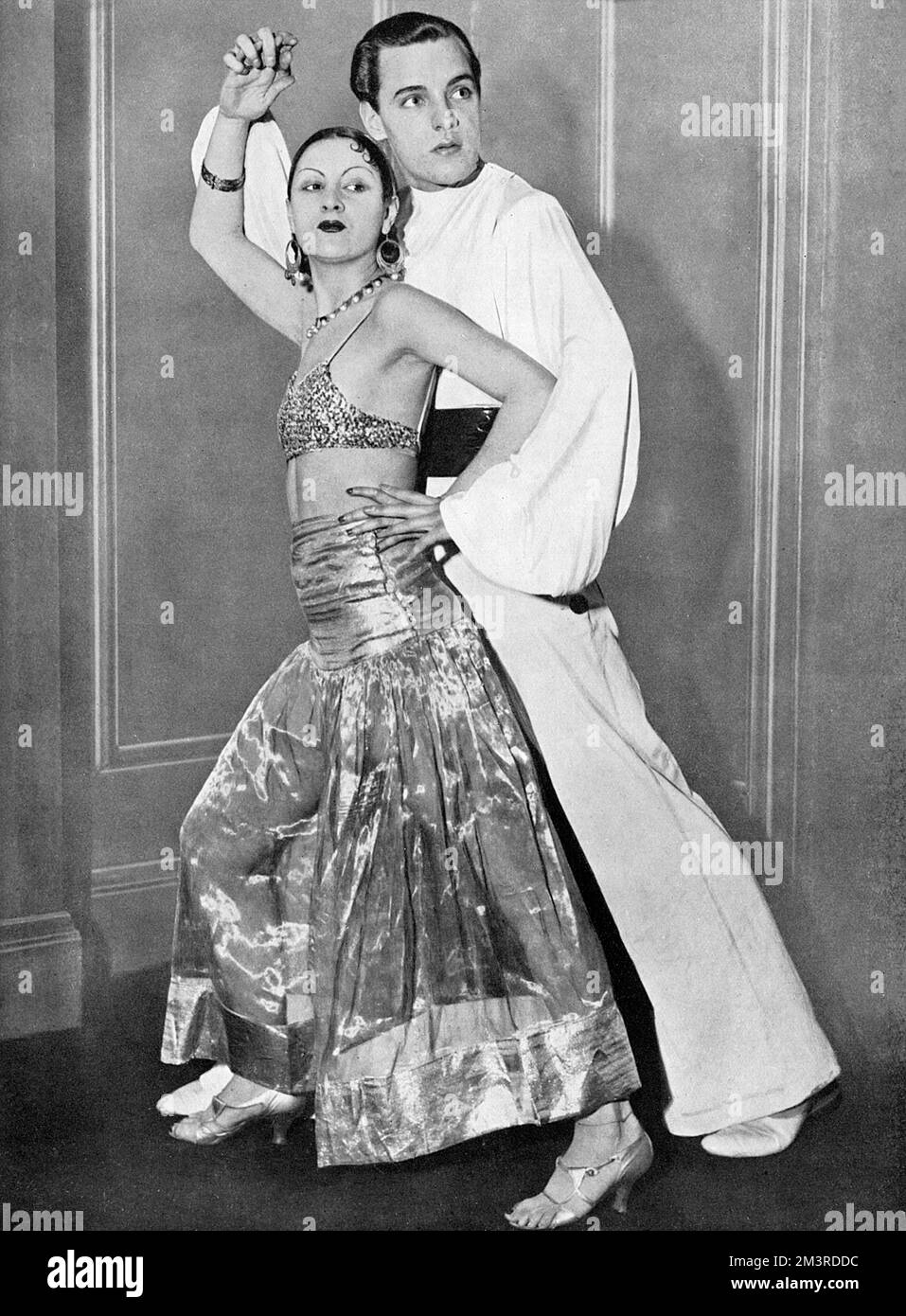 Mlle. Lya del Velez, the well-known dancer and her partner, Mr Brookes, in the costumes they wore at the Chelsea Arts Ball which took place on New Year's Eve at the Albert Hall, 1932.     Date: 1932 Stock Photo