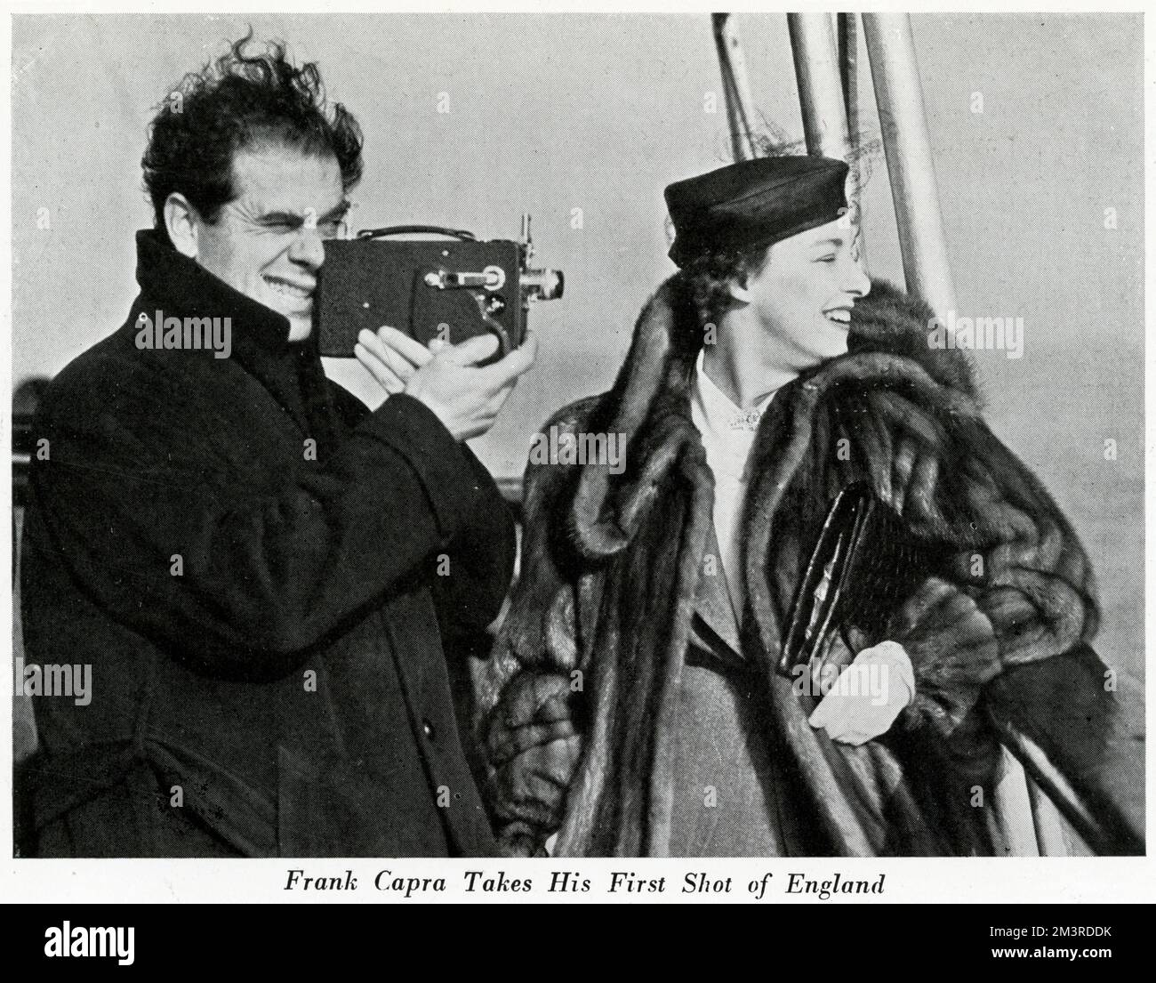 American film director, Frank Capra, along with his wife, Lucille Warner, arrives in Egnland on the ocean liner Normandie.  He attended the film premiere of Lost Horizon at the Tivoli cinema in London.       Date: 1937 Stock Photo