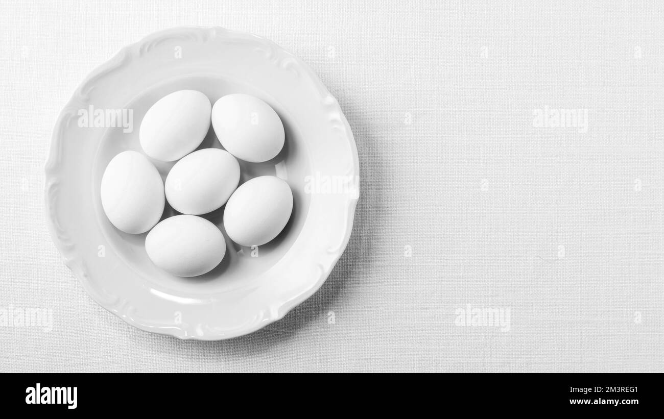 Top view white eggs plate with copy space. Resolution and high quality