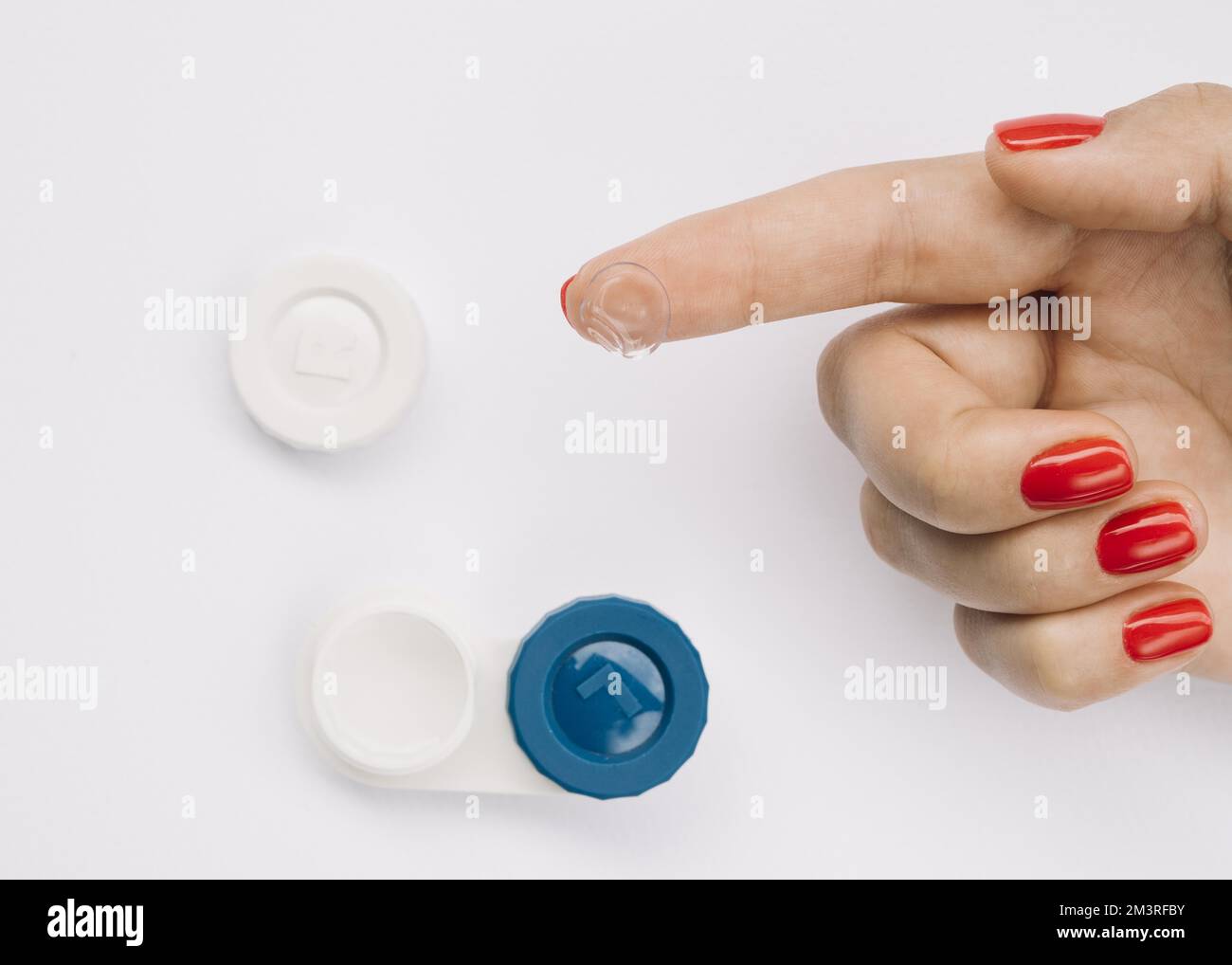 Woman showing camera contact lenses eyeglasses. Resolution and high