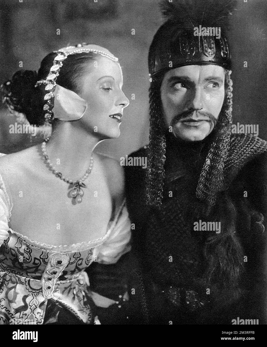 Diana Wynyard and Ralph Richardson pictured in a scene in Humbert Wolfe's play, The Silent Knight, playing at St. James's Theatre in December 1937.     Date: 1937 Stock Photo