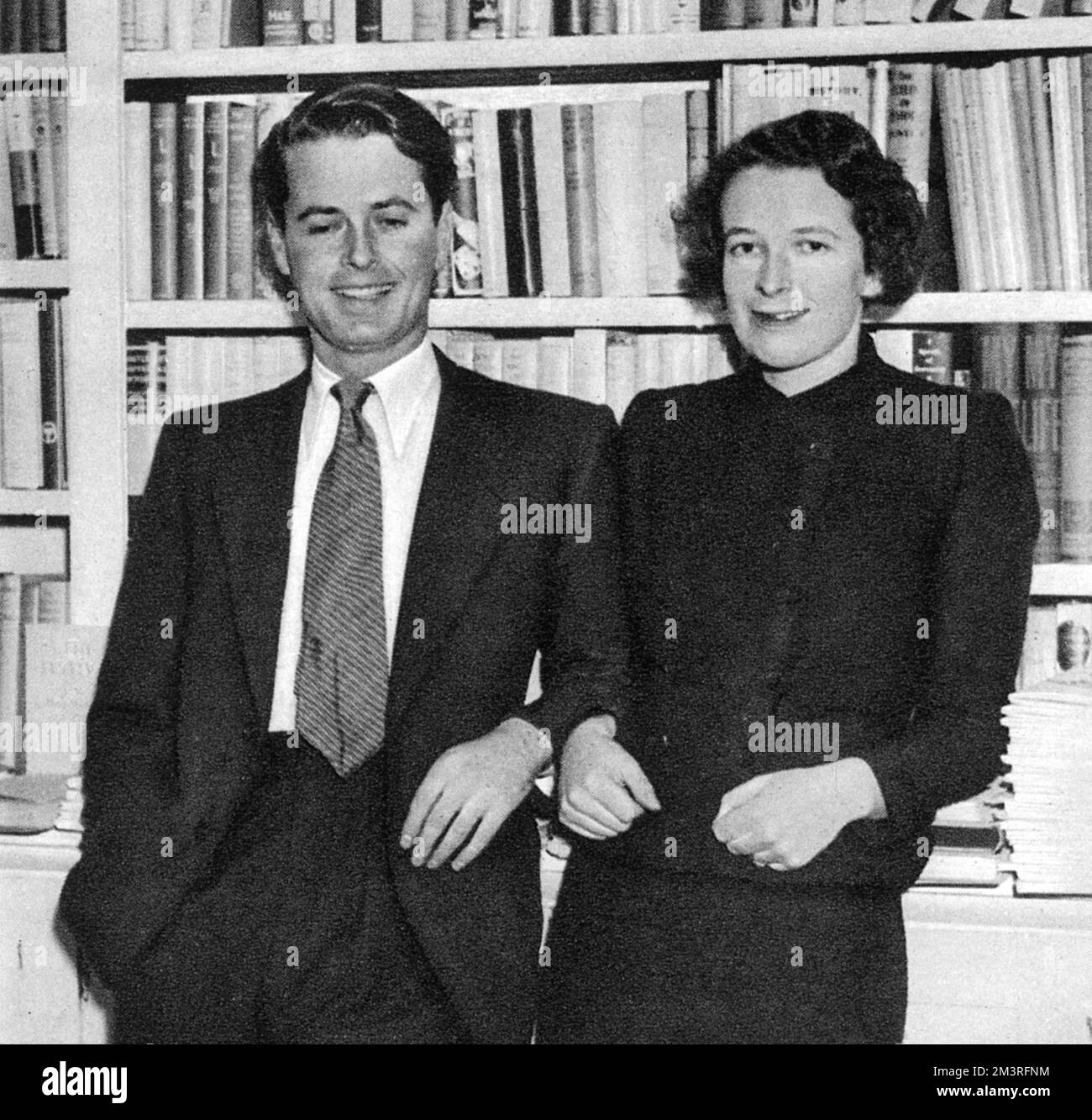 George Heywood Hill, son of Mr. and Mrs. Hill of Great Orchard, Bignor, Sussex and owner of the bookshop at 10 Curzon Street, together with his wife-to-be Lady Anne Gathorne-Hardy.  1937 Stock Photo