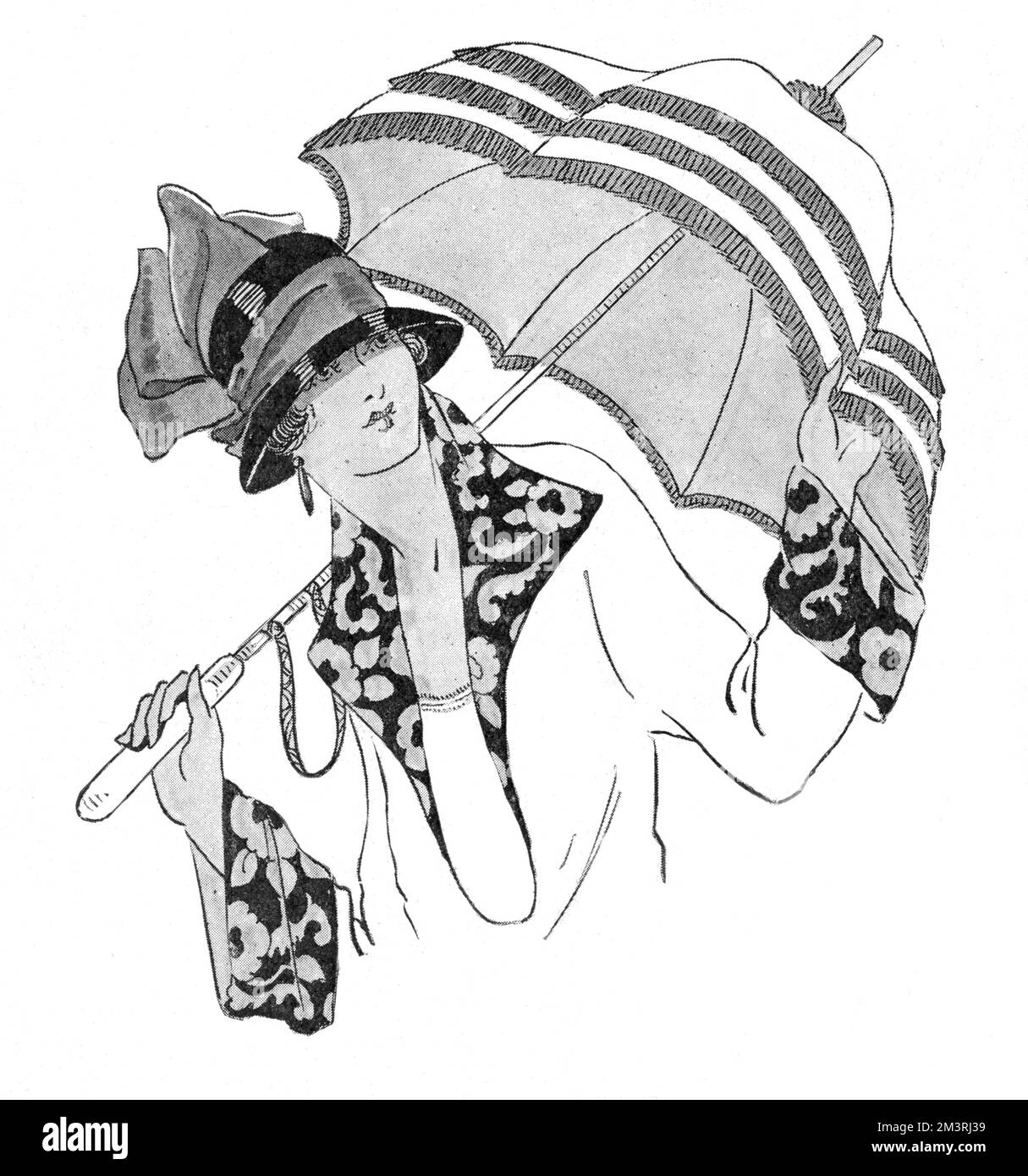 A stylish lady holding a long-handled sunshade / parasol from Harvey Nichols, Knightsbridge, London.     Date: 1923 Stock Photo