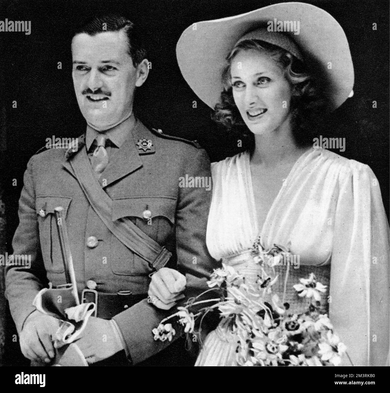 British actor Hugh Williams and Australian stage and screen actress Margaret Vyner photographed on their wedding day.   1940 Stock Photo