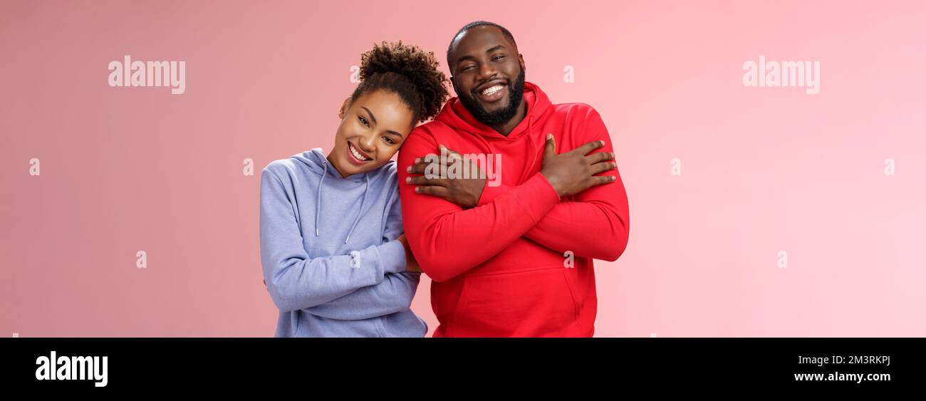 Charming happy sincere african-american family guy girl relationship embracing cross arms chest hugging each other girlfriend lean boyfriend shoulder Stock Photo