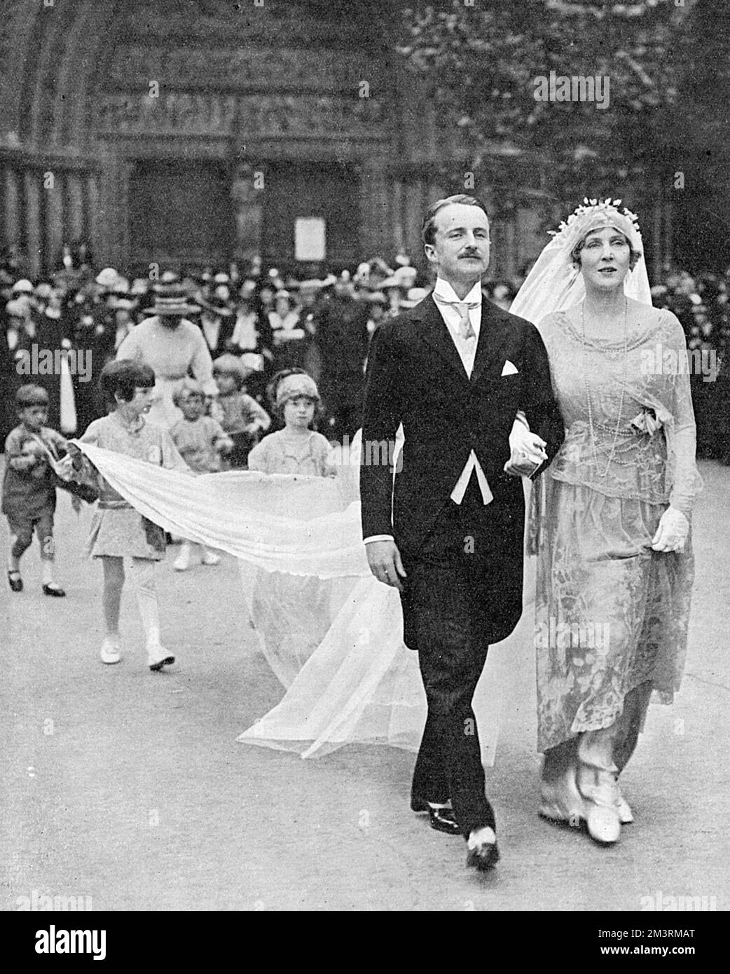Wedding of Lady Diana Cooper (nee Manners) and Alfred Duff Cooper at St. Margaret's Church, Westminster on 2 June 1919.  The newlyweds photographed leaving the church.     Date: 1919 Stock Photo