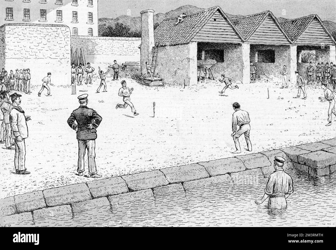 The Blockade of Crete: British Officers Playing Rounders in Suda Dockard.  The Englishman must have his sport wherever he goes and the naval officers on board our ships lying off Crete are no exception to the rule.  Having obtained leave to land, a dozen officers, principally midshipmen, one afternoon took on shore some stumps and a ball.  Rounders was the game chosen.  On account of the ground a rule was made that either side hitting the ball into the sea or onto the roofs should be out.  Some remarkable fielding was witnessed.  Once the ball went into the sea and the fielder after it!      D Stock Photo