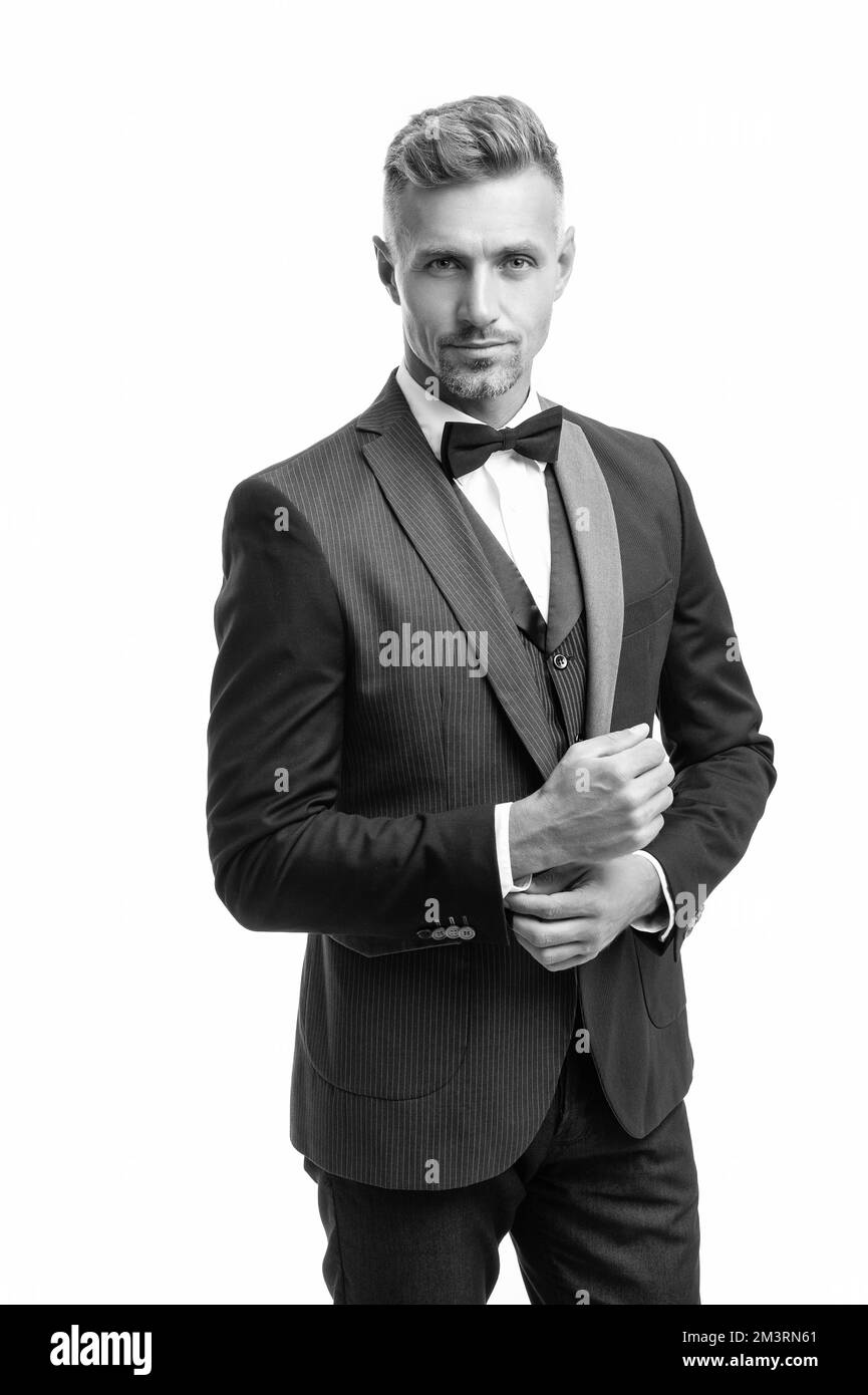 mature elegant man in bow tie suit. businessman isolated on white