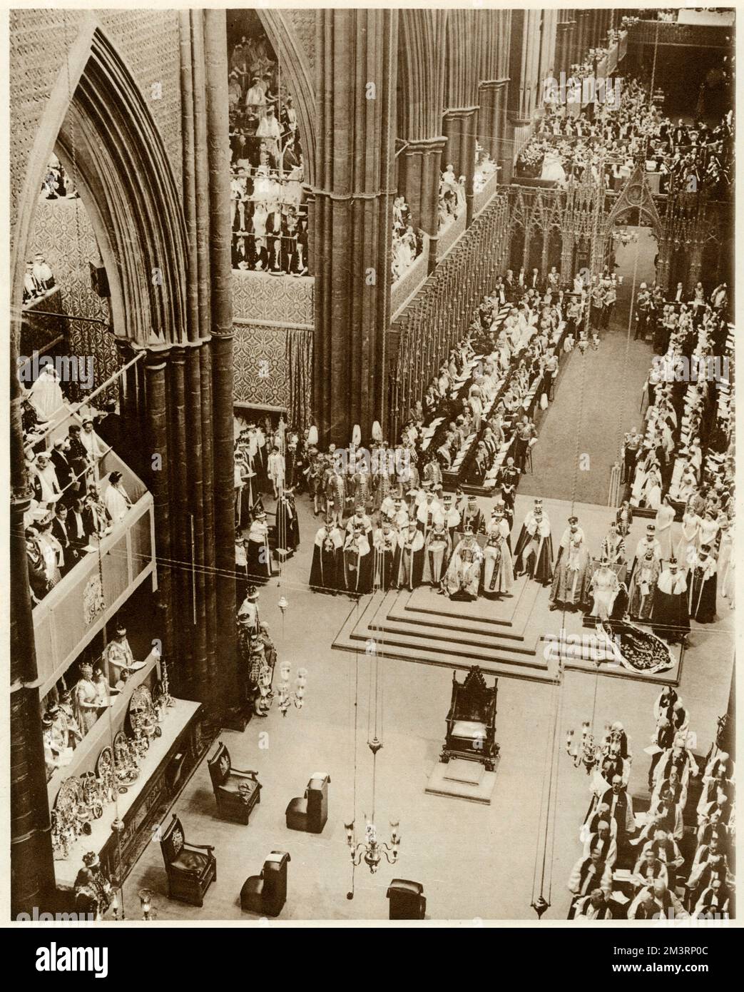 Their Majesties crowned and Inthroned. The splendor of the Interior of Westminster   Abbey during the crowning of king George VI, no more than a photograph can give a true impression of the glory of colour the greatness of the setting or of the majestic and solemn pageantry of the service, ending in the superb triumph of the Te Deum.  12 May 1937 Stock Photo