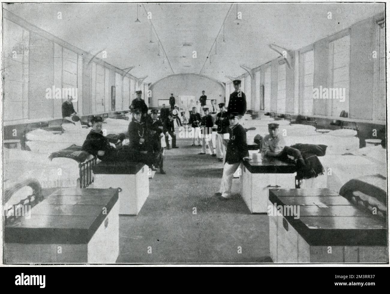 In 1903, part of the estate, the Stable Block being the hub, became a junior officer training college for the Royal Navy known as the Royal Naval College, Osborne, initial training began at the age of 13. Photograph showing the dormitories, where they were up at 6:30 in the morning.     Date: 1905 Stock Photo