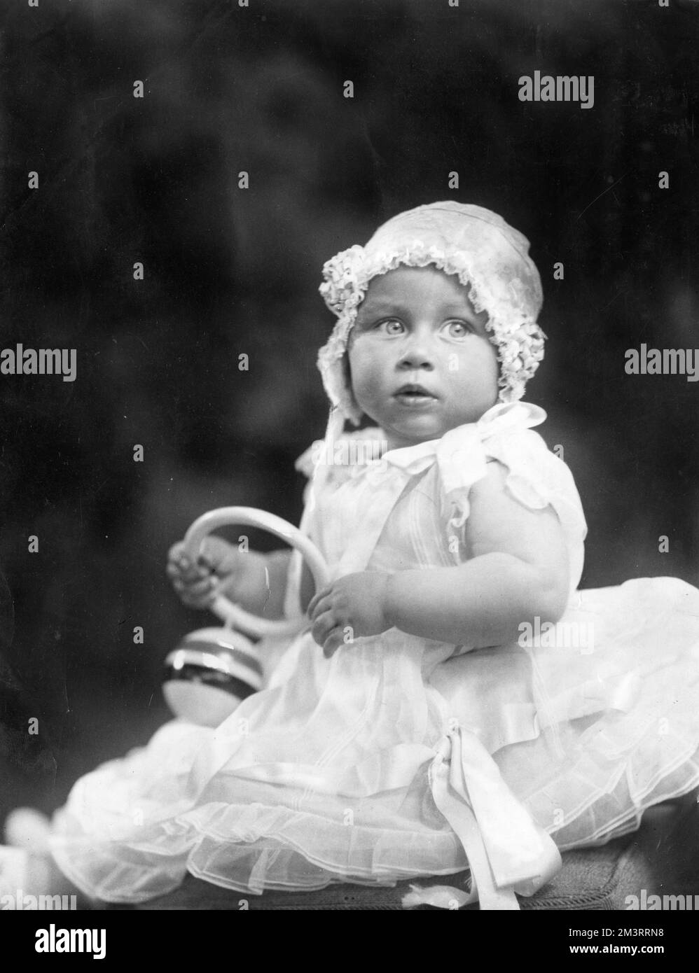 Princess Margaret as a baby of approximately 9 months old, holding a ...