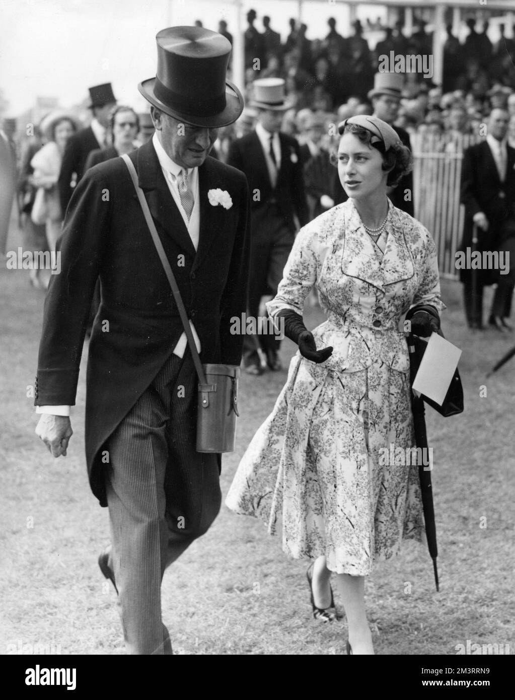 Princess Margaret at the Epsom Derby, walking the course with other members of the royal family.       Date: 1955 Stock Photo