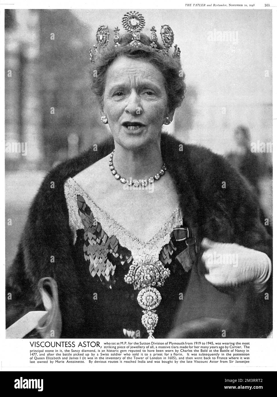 Lady Astor, who sat as MP for the Sutton Division of Plymouth from 1919 to 1945 pictured arriving for the opening of Parliament in 1948 wearing a Cartier tiara featuring the Sancy diamond, a historic gem reputed to have been worn by Charles the Bold at the Battle of Nancy in 1477.  It had other owners including Elizabeth I, James I and Marie Antoinette. Stock Photo