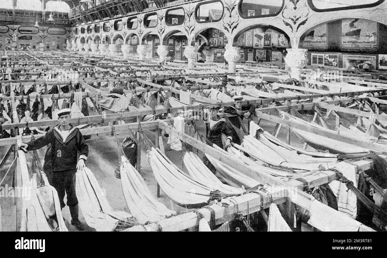 A use found for the Crystal Palace at last: rows of hammocks put up in Canada's building, the sleeping quarters of the Royal Naval Volunteers, at the Crystal Palace, October 1914.     Date: October 1914 Stock Photo