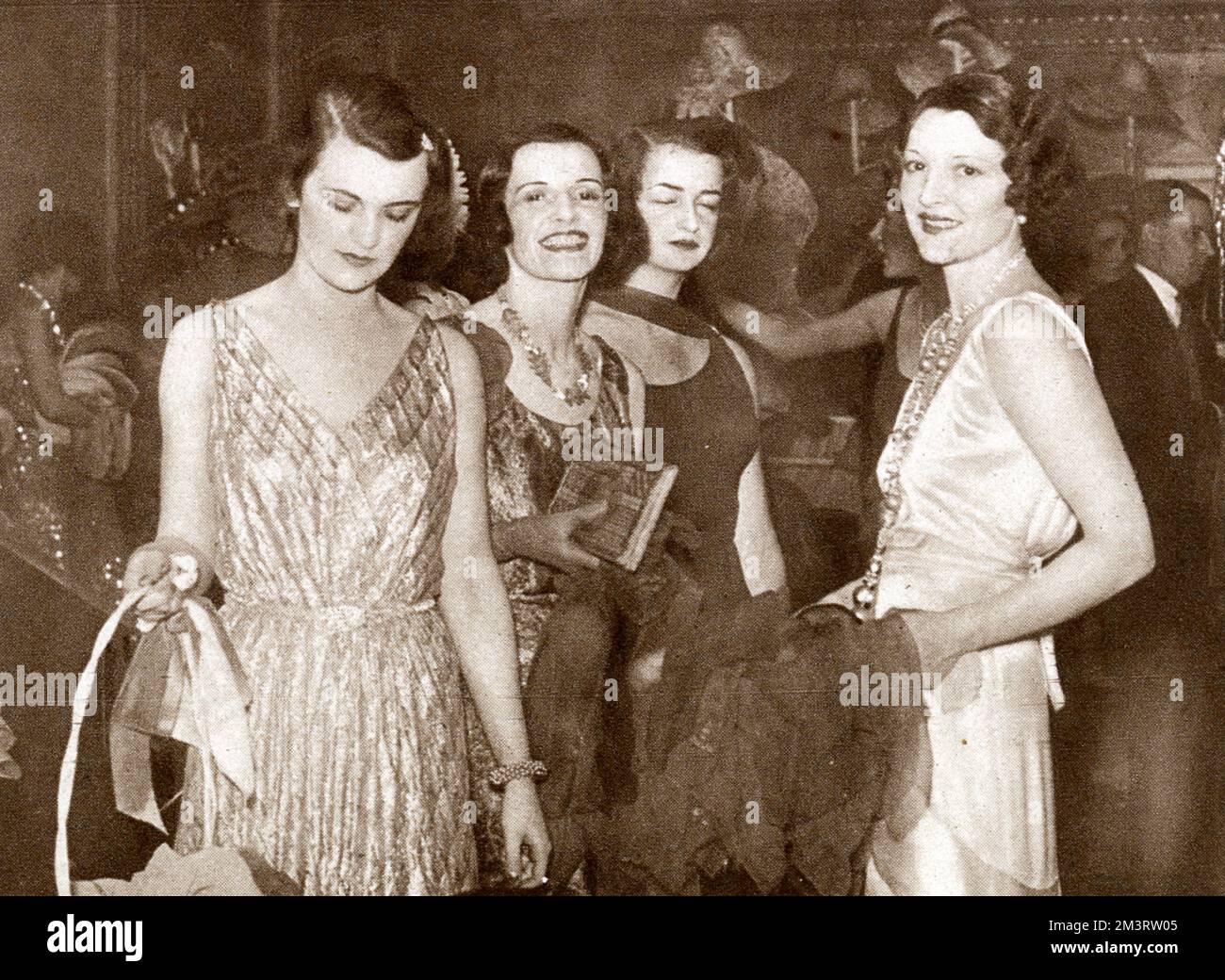 A quartette of young society women at the Westminster Hospital Ball at the Dorchester Hotel in June 1931.  From left, Miss Margaret Whigham, Miss Cathleen Nesbitt, Lady Patricia Moore and Lady Lindsay Hogg (Frances Doble).     Date: 1931 Stock Photo