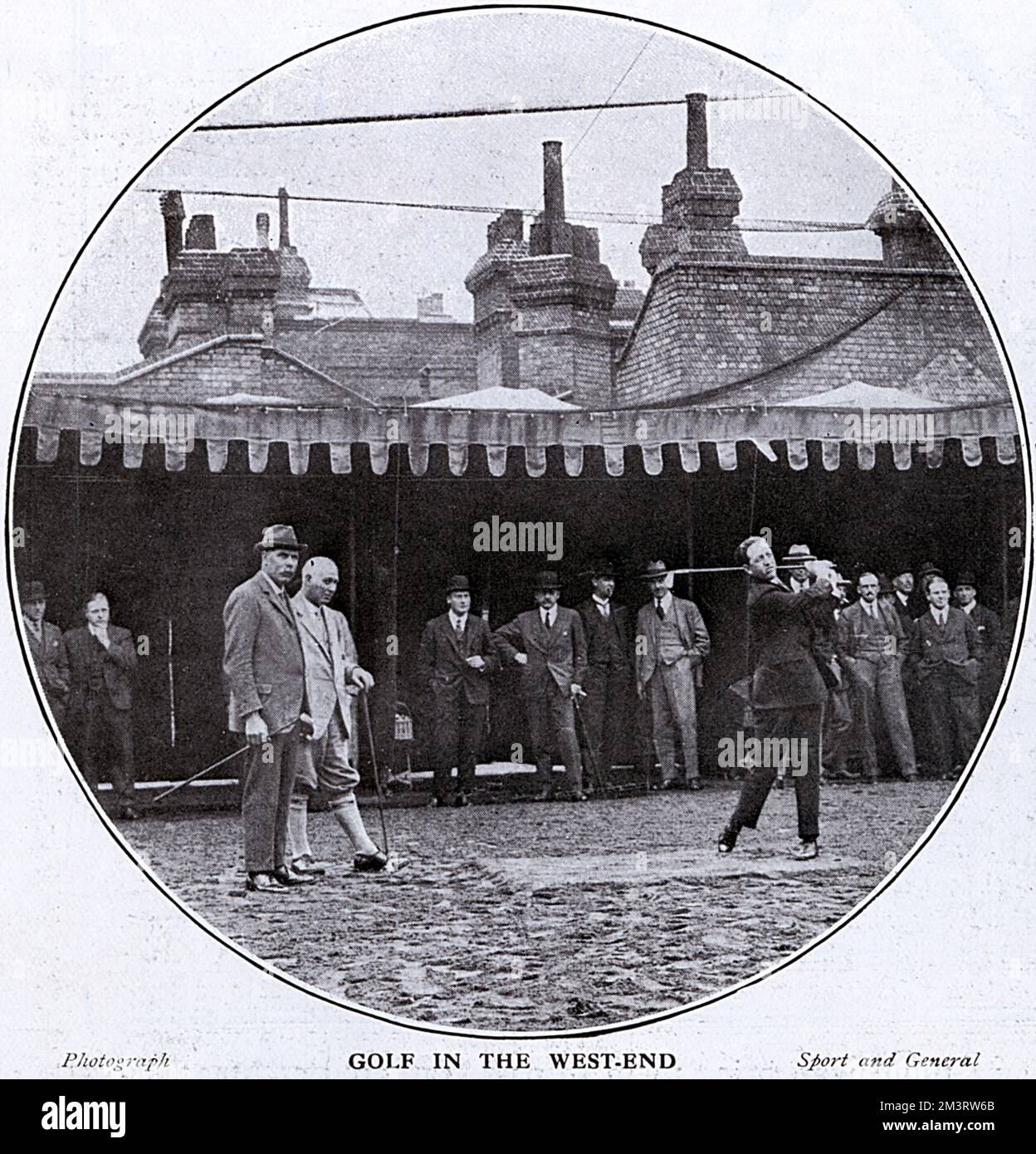 Golfers, including James Braid at the opening of the Piccadilly Open Air Golf Practice Course at 8, Upper St Martin's Lane. The course was on the roof of a garage  1924 Stock Photo