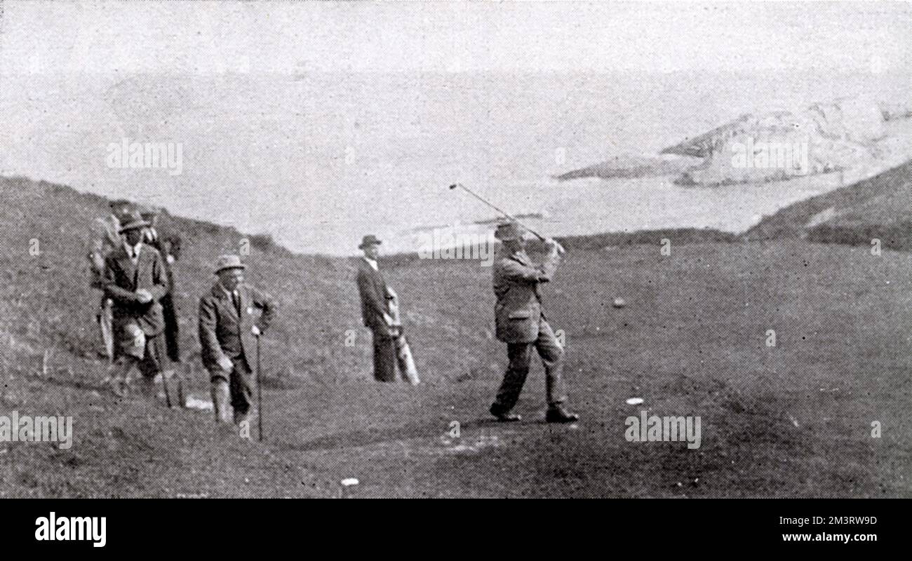 Golfer James Braid taking a shot on the links on the Lee golf course in