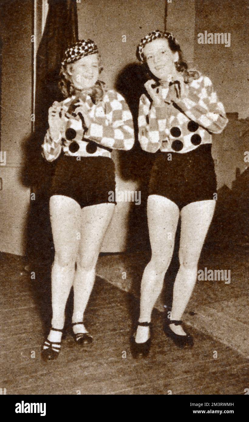 Miss Kristin Gudmundsdottir and Miss Svava Jons tap-dancing; they were part of the 'All This- (And Iceland Too), performed by and to the troops at the Fish Shed Theatre, Reykjavik, Iceland. At this time it was Iceland's only English-speaking theatre.  1942 Stock Photo