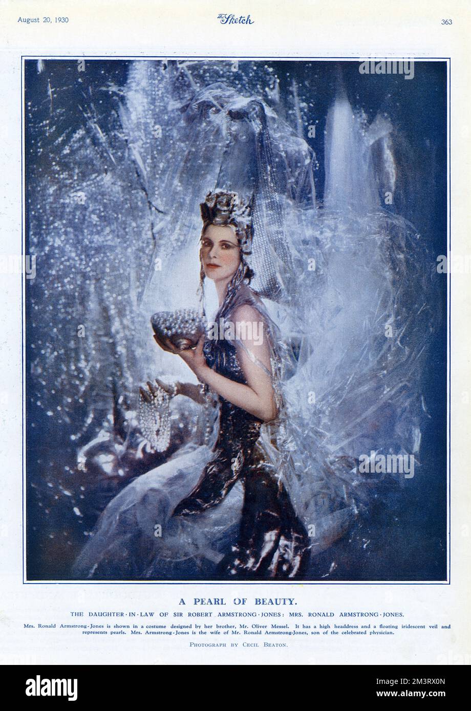 Mrs. Ronald Armstrong-Jones, photographed by Cecil Beaton in a costume designed by her brother, Oliver Messel.  Anne Messel (later Parsons) was previously married to Ronald Armstrong-Jones, with whom she had a daughter and a son, before she married Michael Parsons, 6th Earl of Rosse on 19 September 1935. The couple had two sons. Her eldest son Antony Armstrong-Jones, Earl of Snowdon (from her previous marriage with Ronald Armstrong-Jones) married Princess Margaret.      Date: 1930 Stock Photo