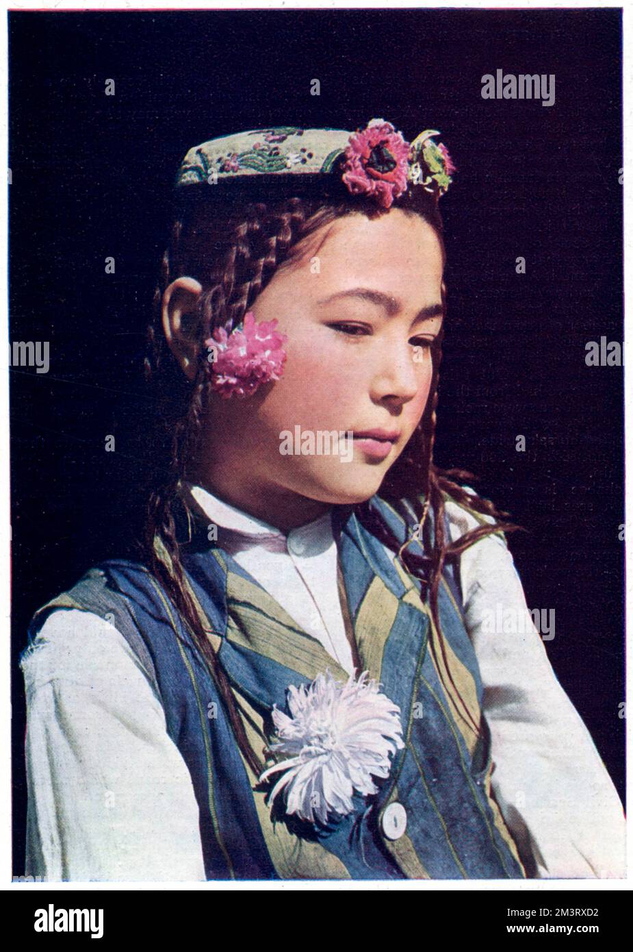 Colour Finlay Process photograph of a young Turki girl of Kashgar.  The Sphere writes, 'The young women of this race are usually attractive and slim, but their charms seldom survive marriage, when too much food and too much work combine to ruin their appearance'.  !!!     Date: 1932 Stock Photo