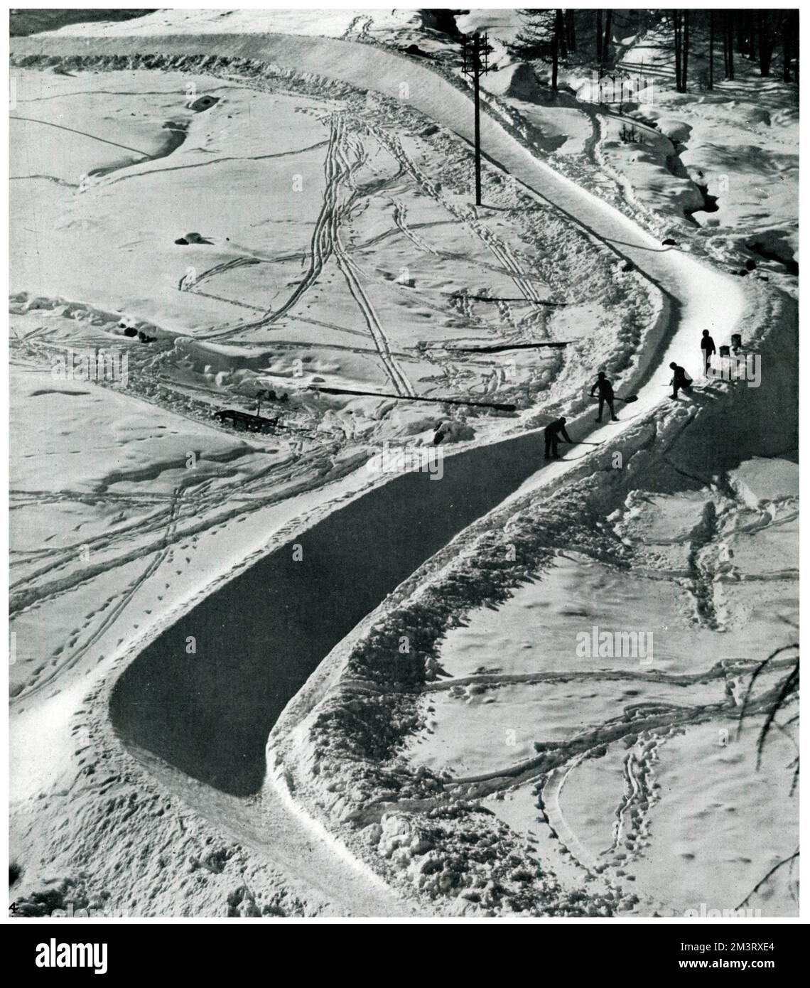 Workmen busy 'tuning up' what is one of the most famous toboggan runs