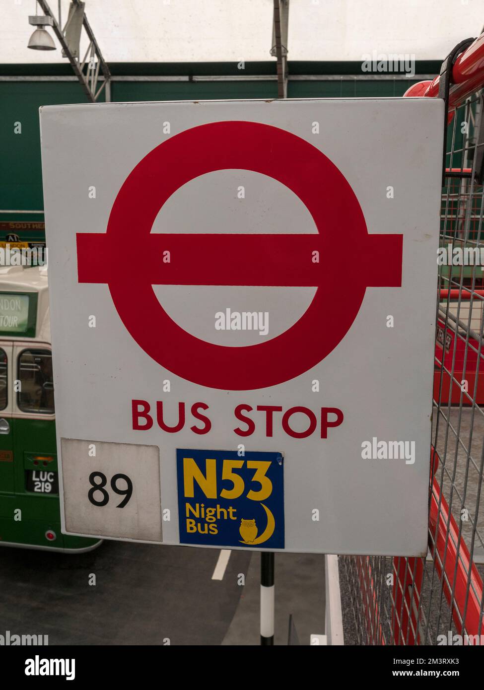 A typical London Transport bus stop sign (for 89 and N53) in the London Bus Museum, part of Brooklands Museum, Surrey, UK. Stock Photo