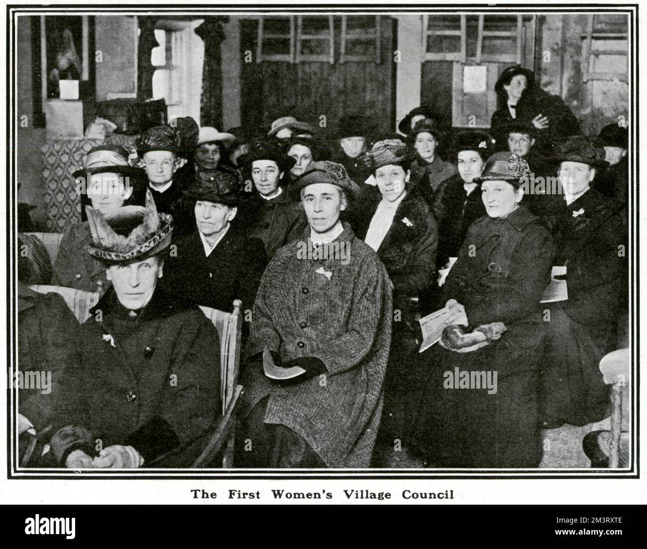 Photograph of the first women's village council in Findon, Sussex, established in 1917. The accompanying article describes the origins of the council in the innate female concern for domestic affairs, exacerbated by a time of housing crisis, particularly in villages and rural areas.     Date: 1918 Stock Photo