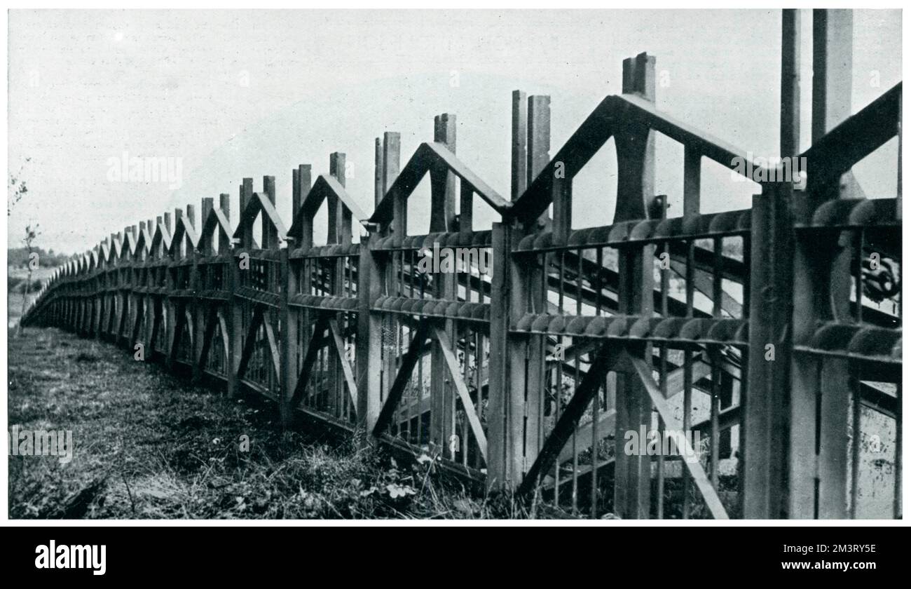 Photograph of a steel wall built on the border between Germany and Belgium as an anti-tank barrier. The Sphere describes its design as of &quot;somewhat unique character&quot;. Despite maintaining its neutrality, Belgium kept close ties with Britain and made preparations for potential German invasion.      Date: 1939 Stock Photo