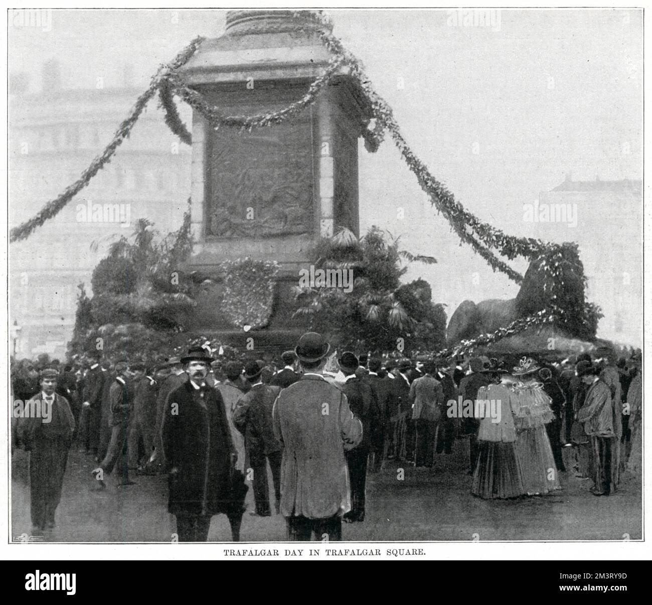 Crowds gather round Nelson's column in Trafalgar Square on Trafalgar Day to celebrate the victory of French and Spanish fleets at the Battle of Trafalgar on 21 October 1805.    21 October 1898 Stock Photo