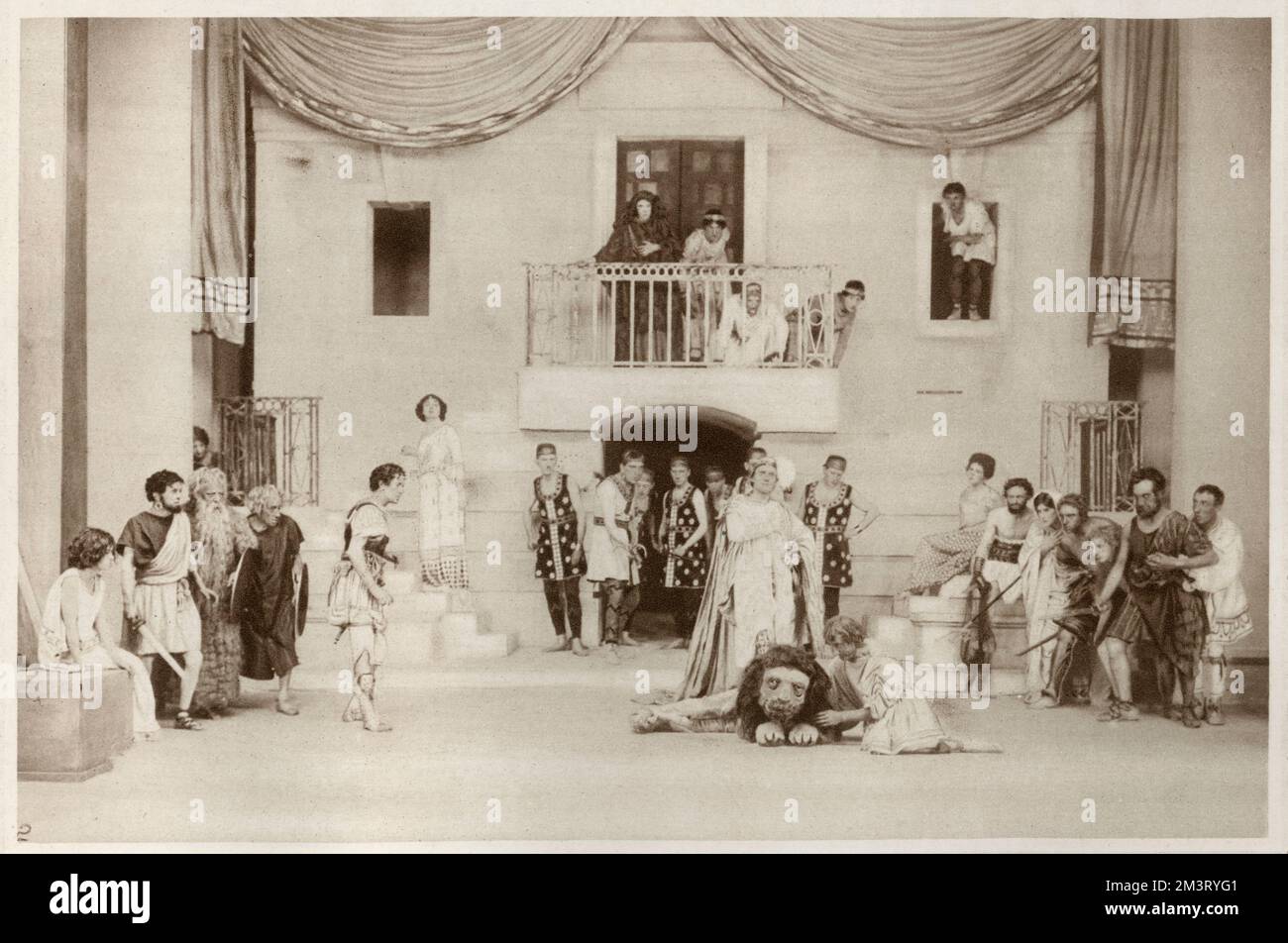 The play Androcles and the Lion by George Bernard Shaw at the St James's Theatre, London. The emperor places his foot on the lion's head while Androcles keeps the beast quiet, and shows his power in this way as well as by pardoning the Christians. Leon Quartermaine is the emperor; Edward Sillward is the lion; O.P. Heggie is Androcles.     Date: 1913 Stock Photo