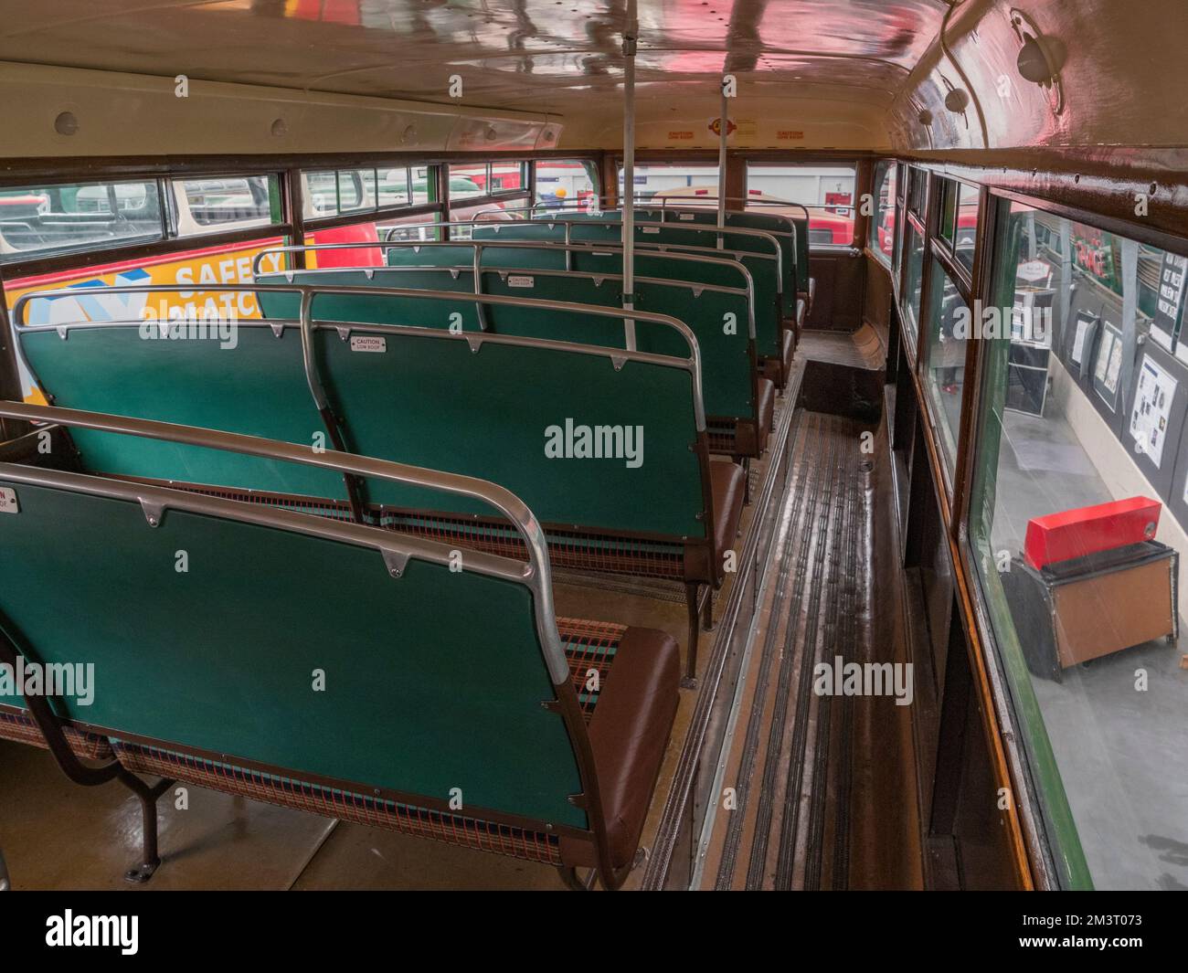 Seating area upstairs inside a 1952 AEC Regent III  London Transport green bus, London Bus Museum, part of Brooklands Museum, Surrey, UK. Stock Photo