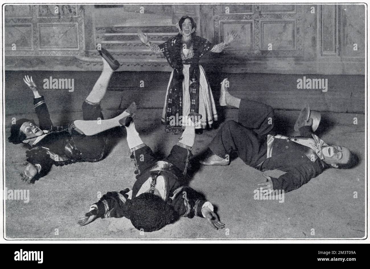 Scene from the London Hippodrome's Christmas production, The Golden Princess and the Elephant Hunters, with cast members falling over due to a sneeze given by Ma-in-law (Miss Martha). On the left are Leonard and Francois as the king's physicians and on the right, the jester, played by Marceline the Droll, the Hippodrome's clown.                                                                             Humorous scene from the Christmas show at the London Hippodrome, The Golden Princess and the Elephant Hunters. The terrible effect of a sneeze has the royal physicians, Leonard and Francois, an Stock Photo
