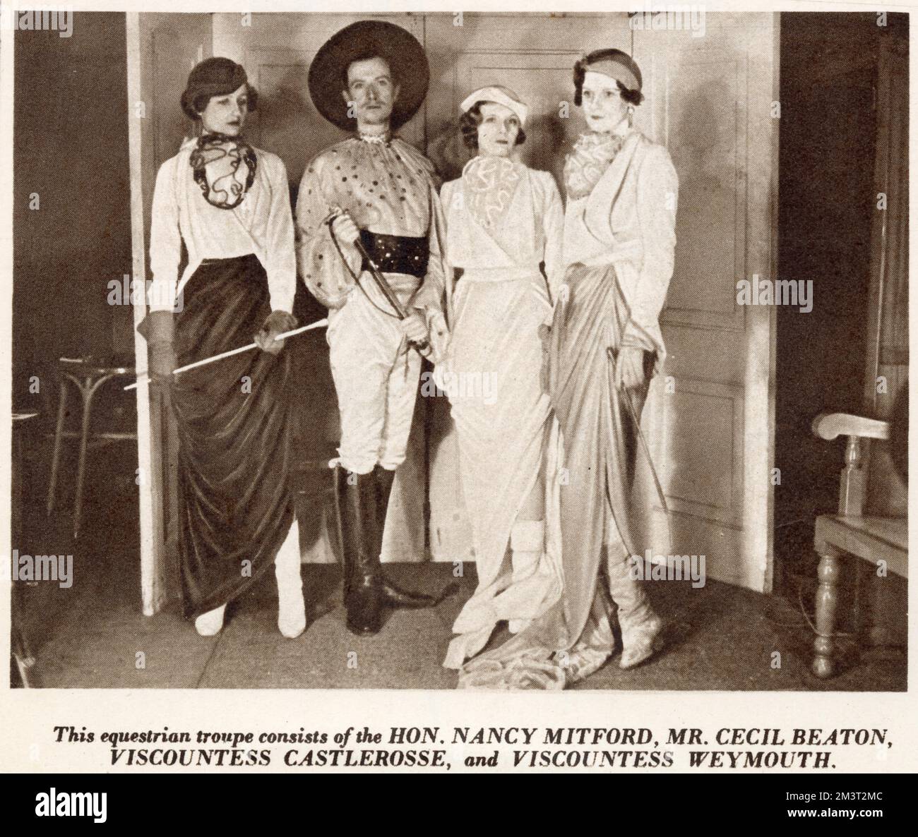 The equestrian group at the Circus Ball, Grosvenor House, 1933. From left, Nancy Mitford, Cecil Beaton, Lady Castlerosse and Viscountess Weymouth. Stock Photo