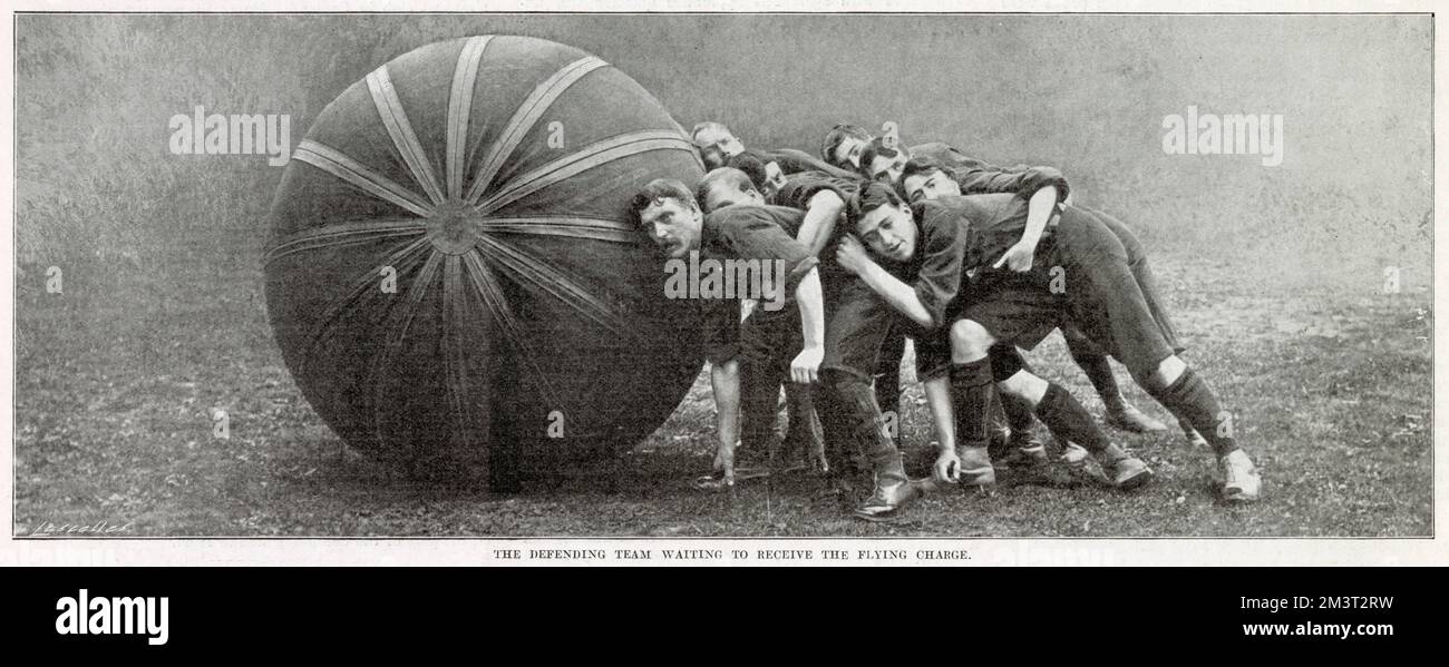 A game of 'pushball' between Anerley and Crystal Palace at the Crystal Palace sports ground. This match, one of the first played in Britain of this American game, was won by Anerley by 1 goal and 3 tries. The ball itself weighed 50lb. The ball itself weighed 50lb. Photograph showing the defending team waiting to receive the flying change.     Date: 4th October 1902 Stock Photo