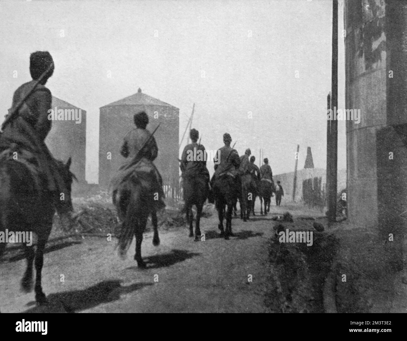 Cossack patrol in Balakhany, near Baku in Azerbaijan. Cossacks patrolling the oil fields after conflict between the Armenians and Tartars and subsequent fighting between the Tartars and Russian government troops led to destruction of the oil derricks that had covered the area. The massacres started during the Russian Revolution of 1905.     Date: 1905 Stock Photo