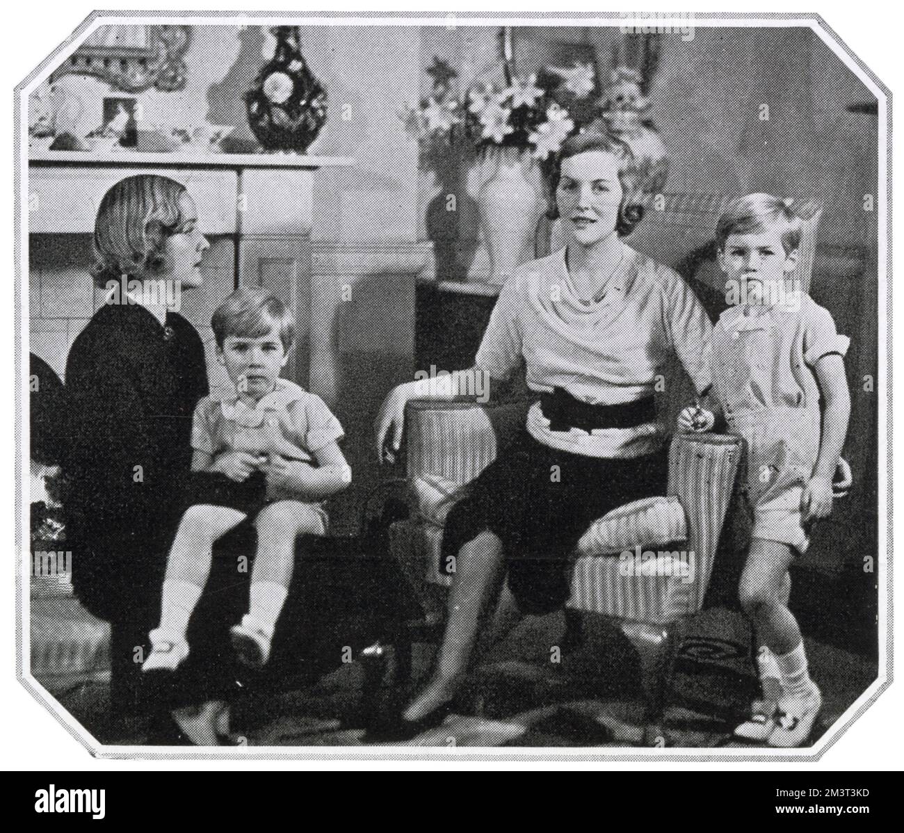 Mrs Bryan Guinness, formerly Diana Mitford, pictured in her home with her sister Unity Mitford and her two sons, Jonathan and Desmond. Stock Photo
