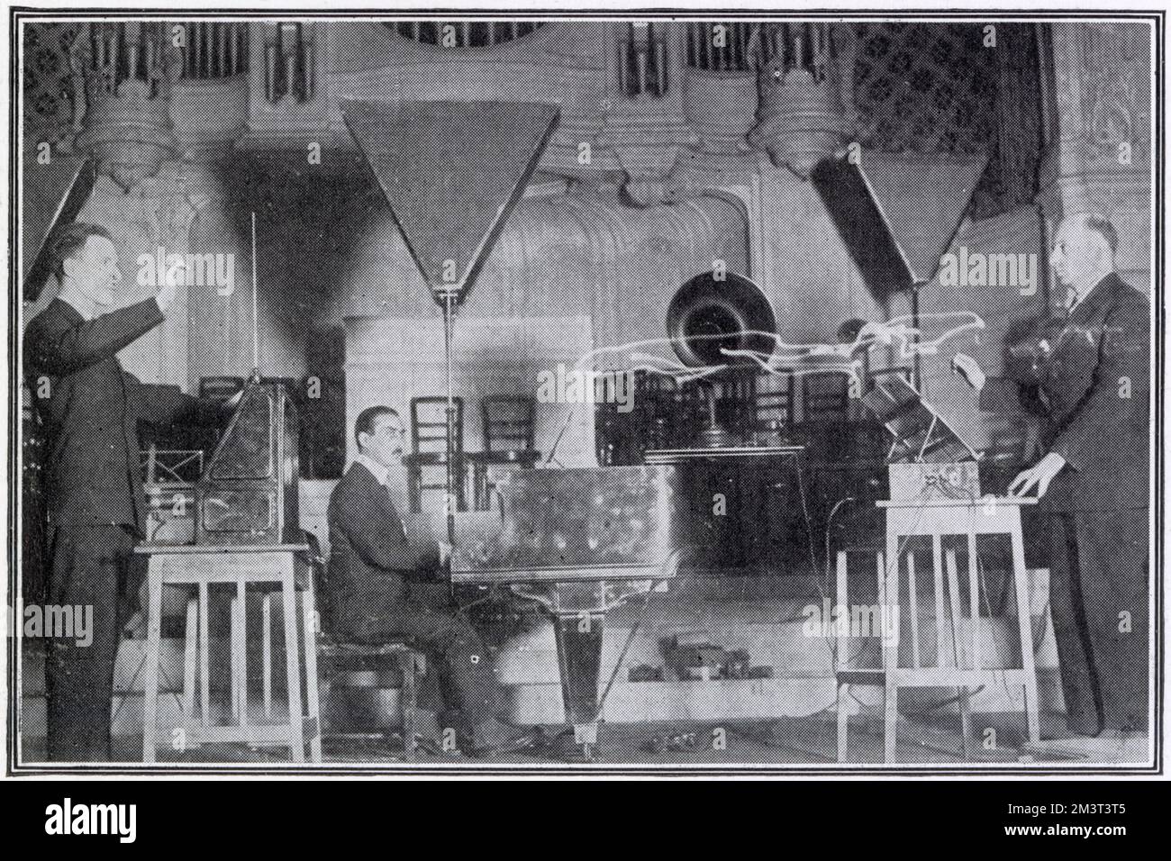 Leon Theremin (1896 - 1993) giving a demonstration of his electronic musical instrument in concert at the Albert Hall (pictured) where he played Schubert's 'Ave Maria' and other airs. He is shown here in duet with Mr Goldberg. Theremin was a Russian and Soviet inventor, most famous for his invention of the theremin, one of the first electronic musical instruments and the first to be mass-produced. Stock Photo