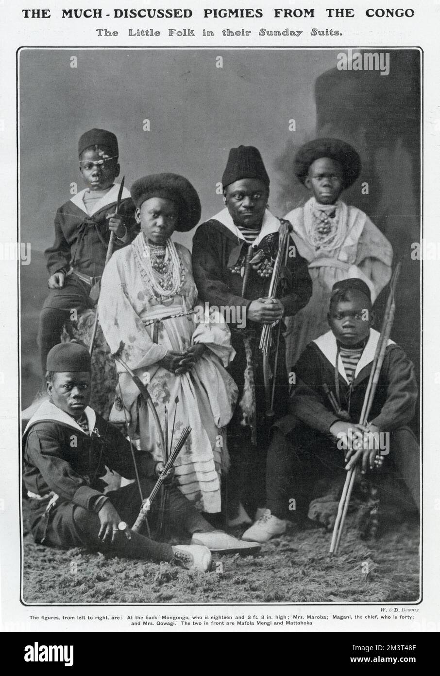 Six Bambuti pigmies from the Ituri Forest in what is now the Democratic Republic of Congo, in a photograph The Tatler describes as showing, 'the little folk in their Sunday best'. They were brought to the UK by Colonel Harrison of Brandeston Hall, E. Yorkshire and appeared at the London Hippodrome after which they toured around the country, staying with Harrison in Yorkshire in between times. They returned to the Congo after two years.      Date: 1905 Stock Photo