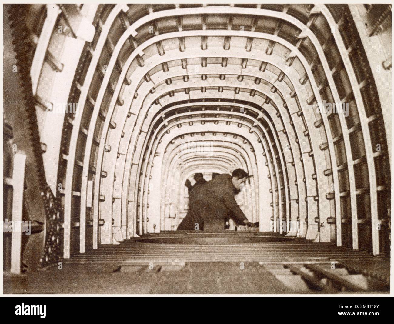 The interior of the fuselage of the Whitley bomber at Armstrong Whitworth in Coventry. The photograph gives a good impression of the size of the aircraft and shows the construction.      Date: March 1939 Stock Photo