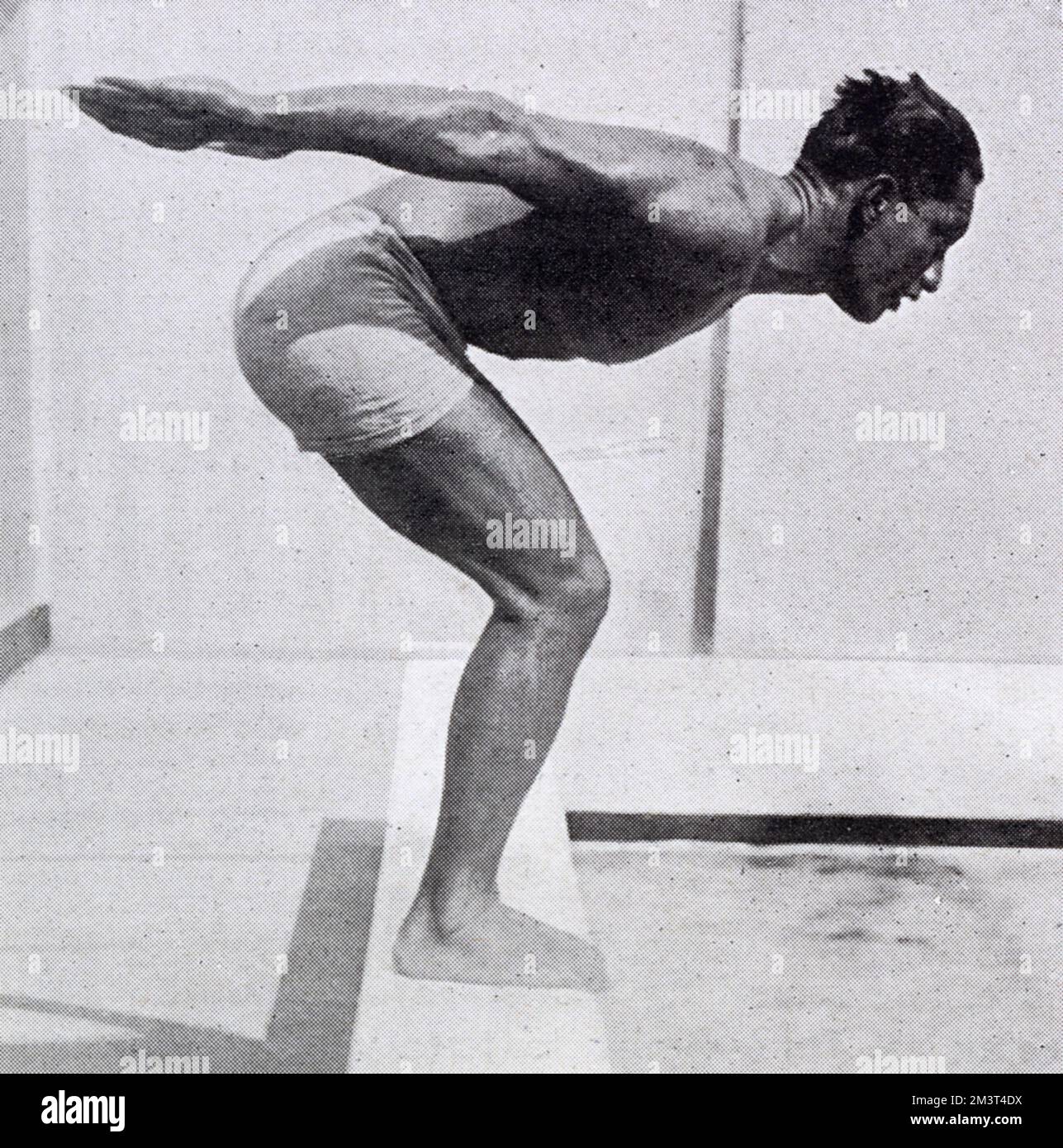 Hawaiian swimmer and surfer Duke Kahanamoku in a diving pose. Stock Photo