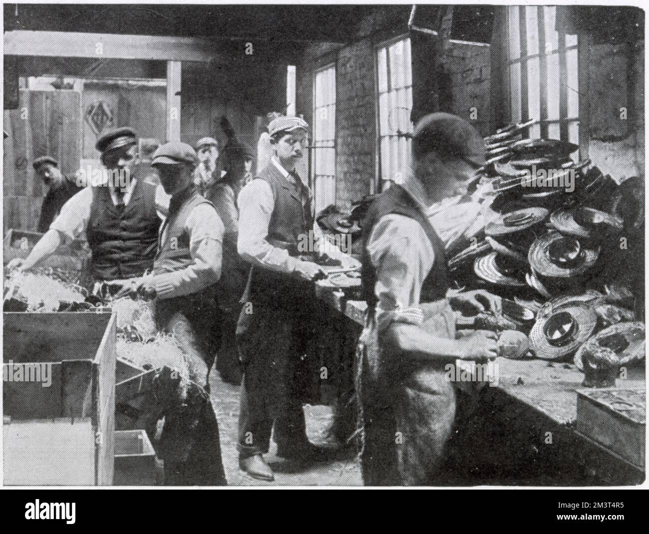 A workshop where men are making paper Chinese lanterns for the coronation of Edward VII. Stock Photo